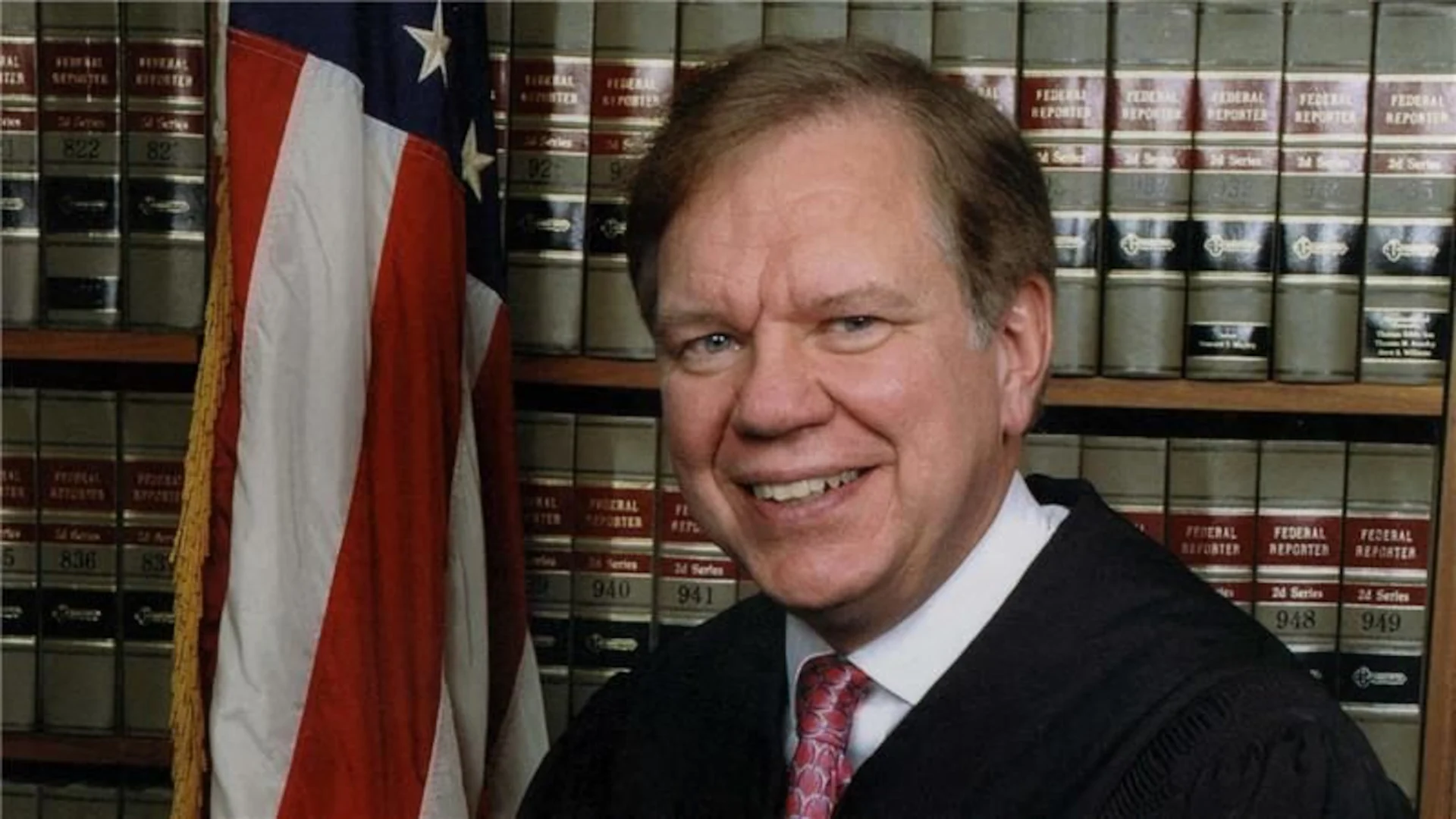Judge Thomas Ambro in a formal portrait or public event setting, wearing judicial robes