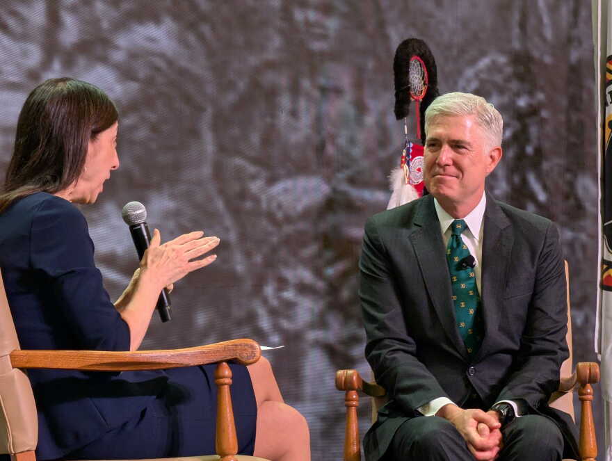 Justice Neil Gorsuch speaking at a public event.