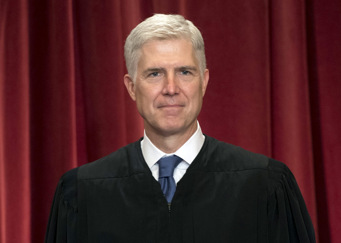 Justice Neil Gorsuch walking near the United States Supreme Court building in Washington, D.C.