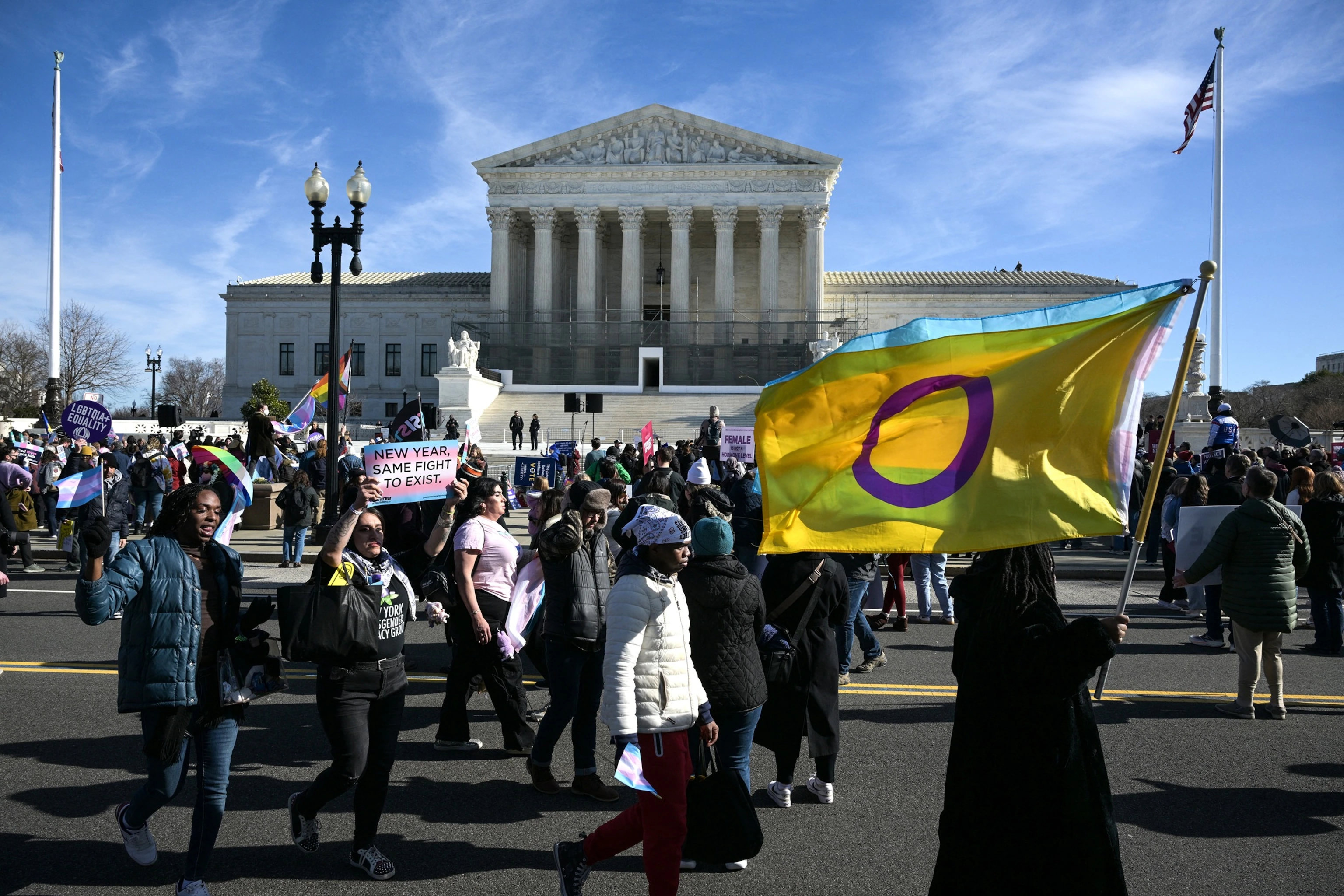 LGBTQ+ rights advocates gathered outside the U.S. Supreme Court in Washington, DC, during arguments over transgender student athlete bans on January 13, 2026