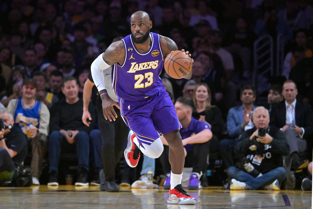 LeBron James in a Los Angeles Lakers uniform during an NBA game, photographed on the court under arena lights