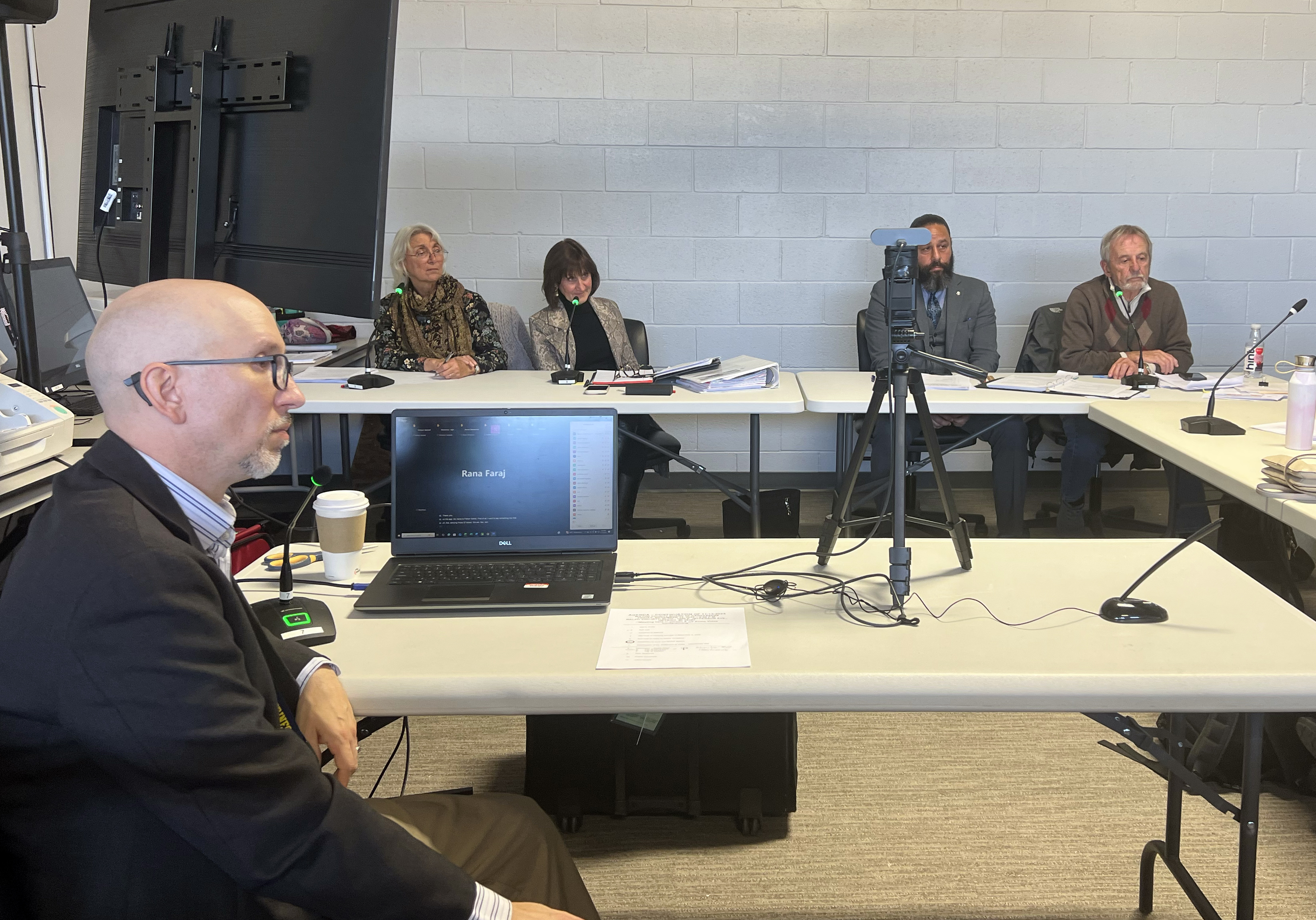 Members of the Wayne County Board of Canvassers at a public meeting in Michigan