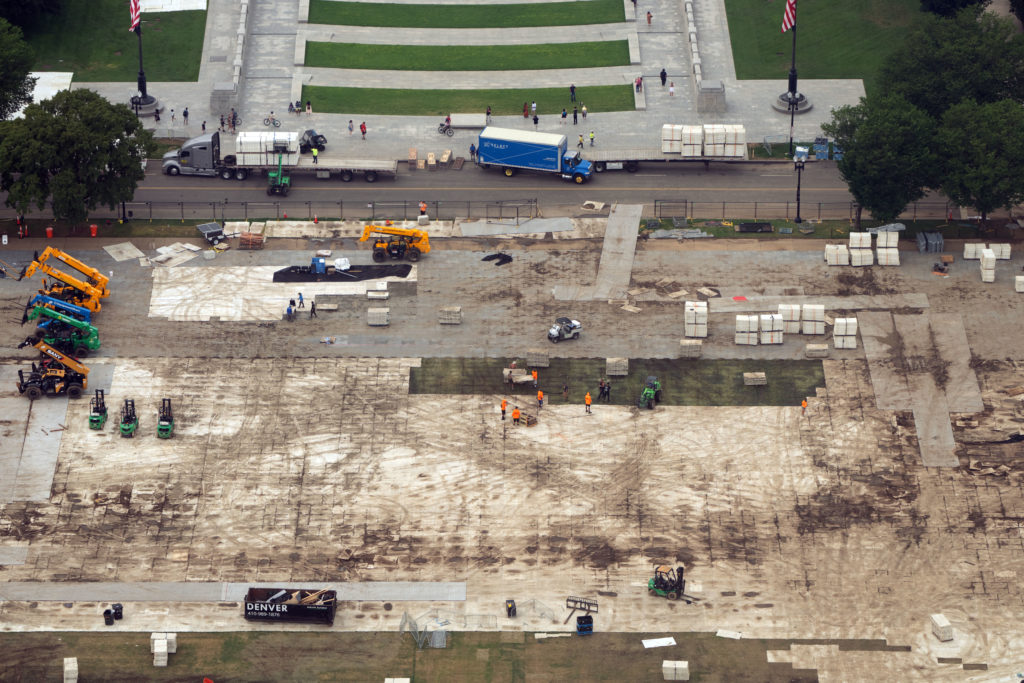 National Park Service maintenance crews repairing damaged turf on the National Mall in Washington, DC