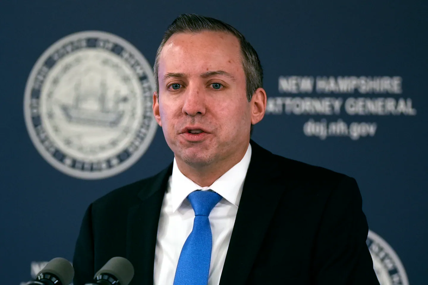 New Hampshire Attorney General John Formella speaking at a press conference.