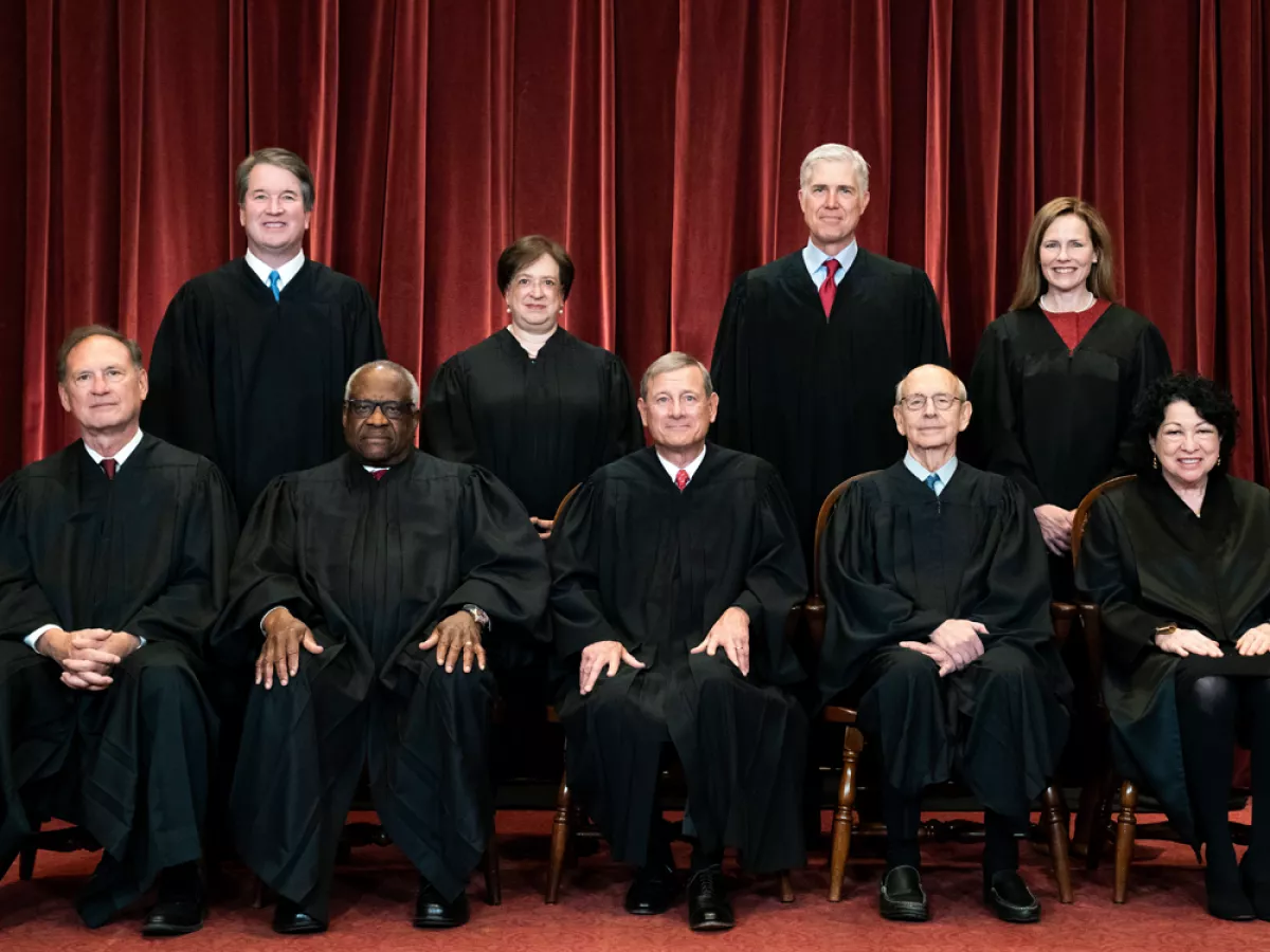 News-style photograph of the United States Supreme Court building in Washington, D.C., on a bright day with people walking on the steps, taken around the time of major administrative law decisions