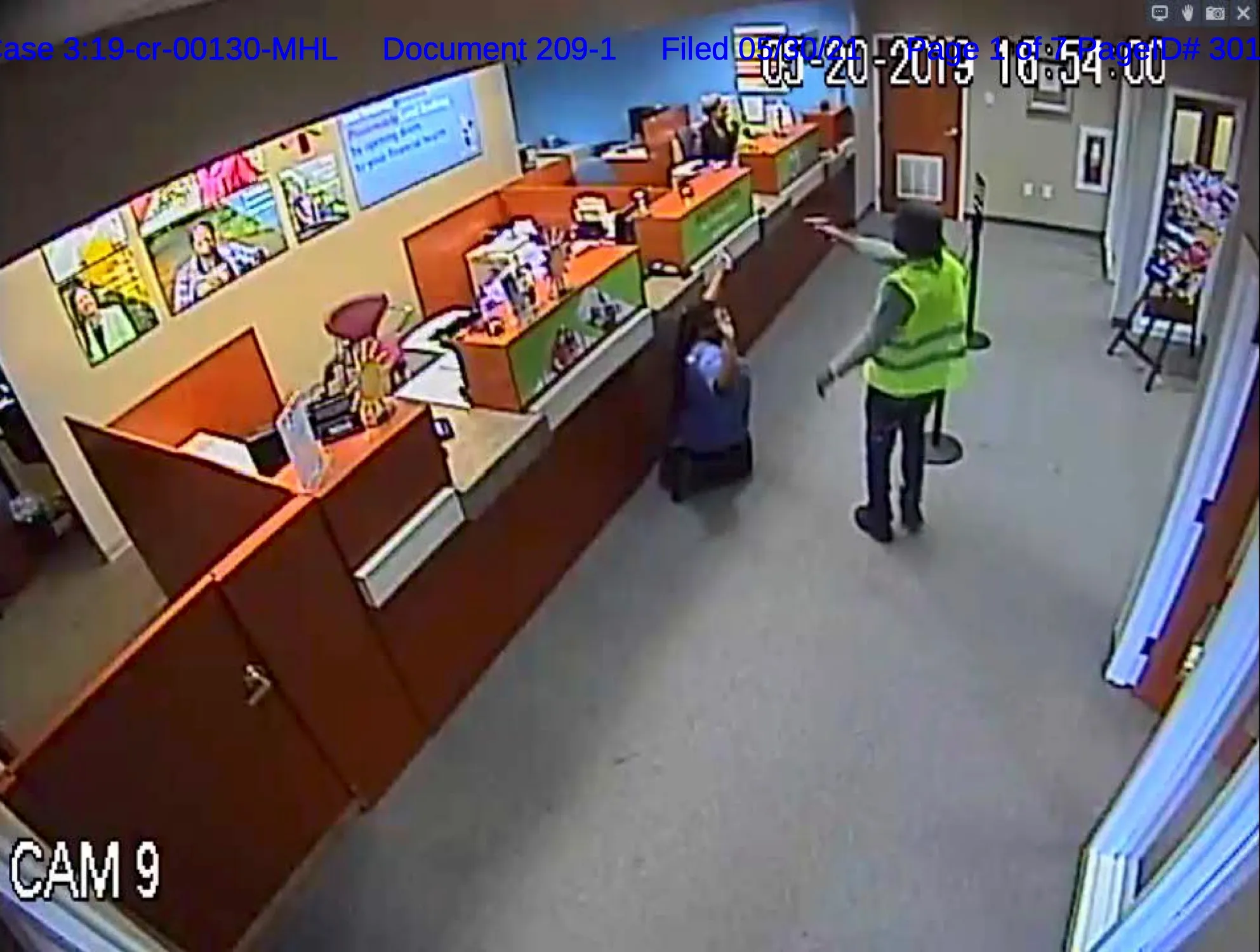 Police investigators standing outside a bank in Midlothian, Virginia, during an active investigation, with patrol cars in the background, news photography style