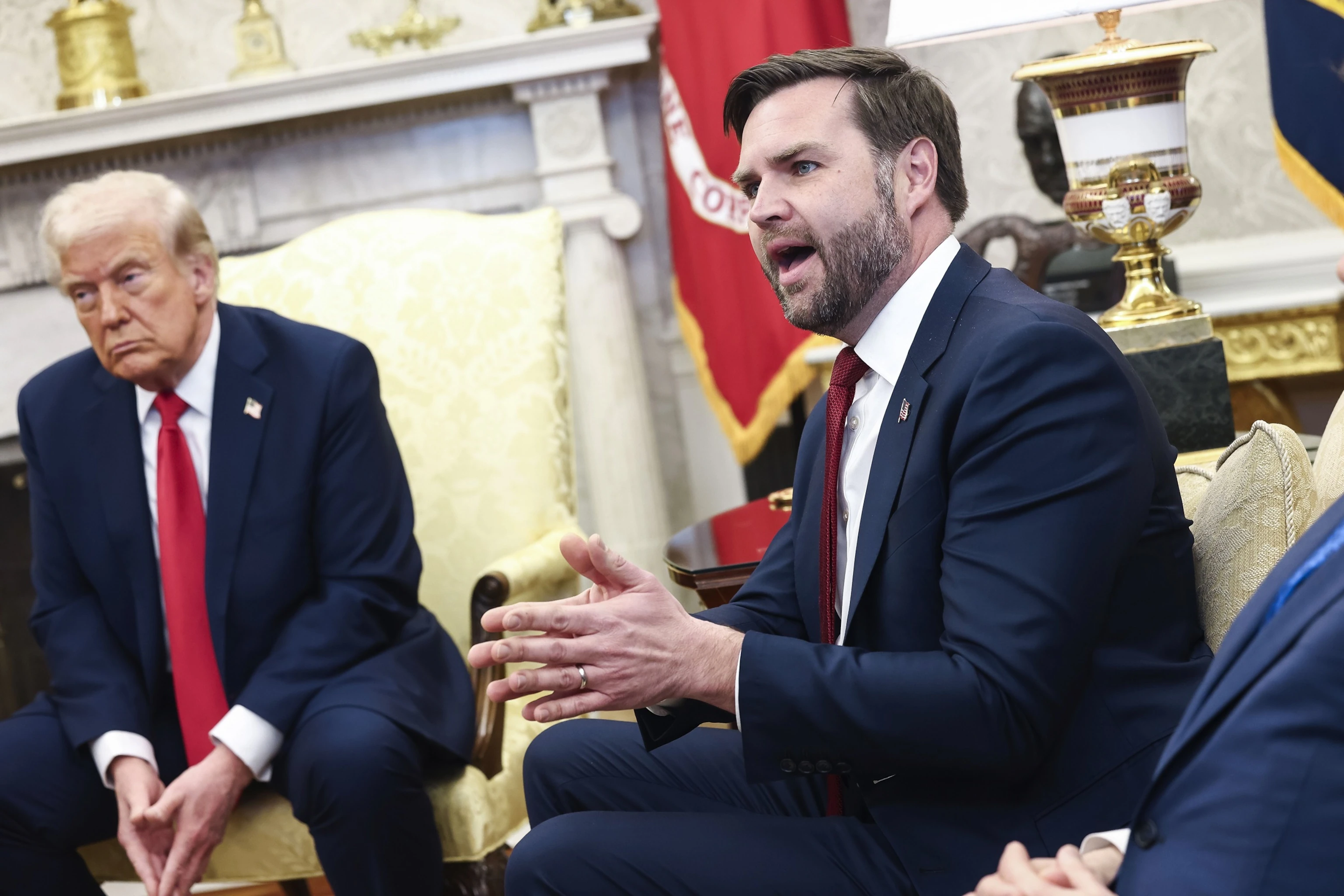 President Donald Trump and Vice President JD Vance speaking during an Oval Office event at the White House