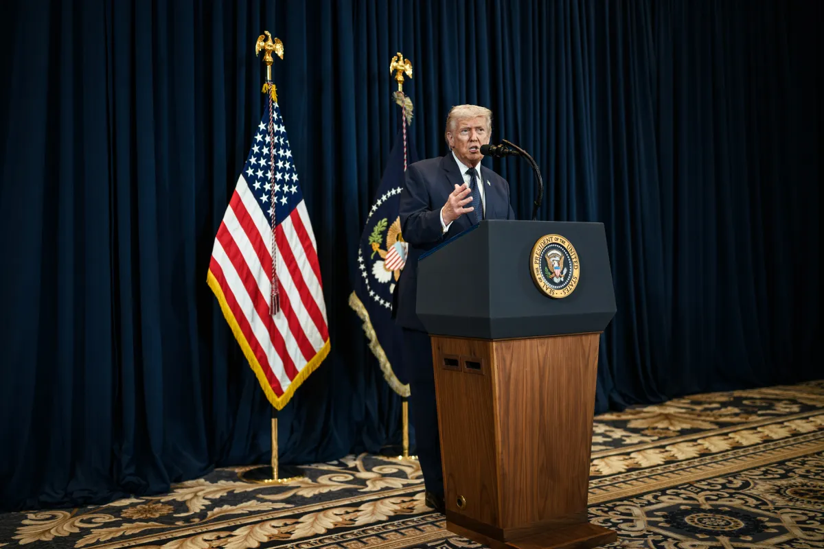 President Donald Trump standing at a lectern at the White House during a public appearance in a straightforward, official setting