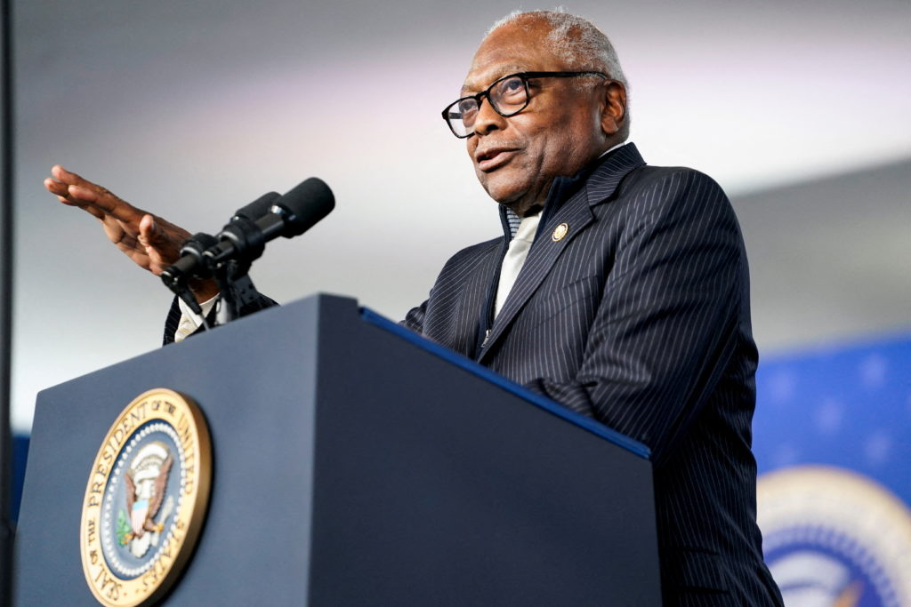 Representative James E. Clyburn standing at a podium in South Carolina during a public appearance, wearing a dark suit, news photography style
