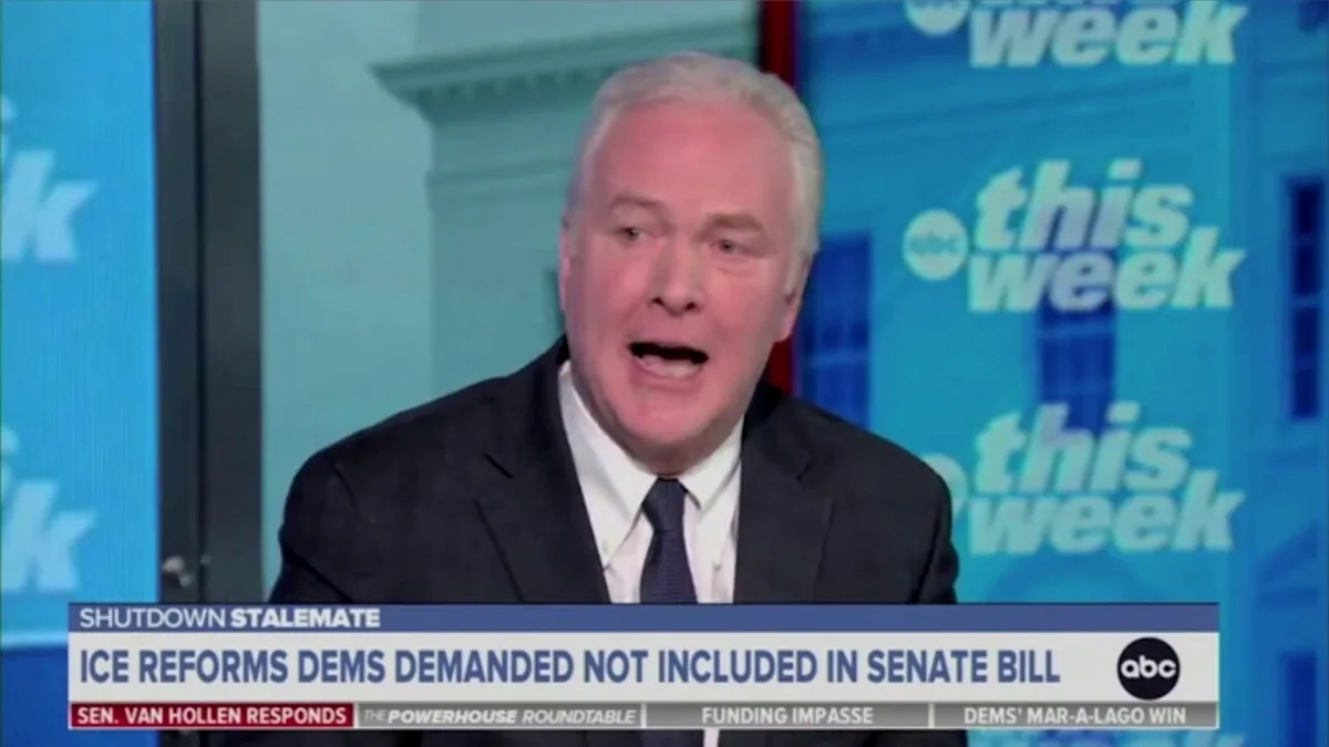 Sen. Chris Van Hollen speaking during a televised interview, seated under studio lighting, news photography style