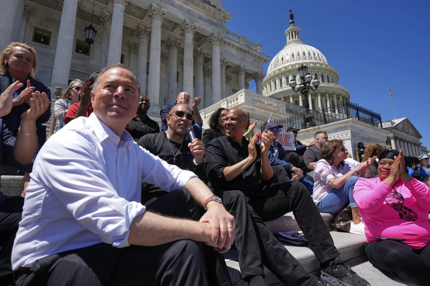 Sen. Cory Booker standing on the steps outside the U.S. Capitol, speaking during a media availability, news photography style