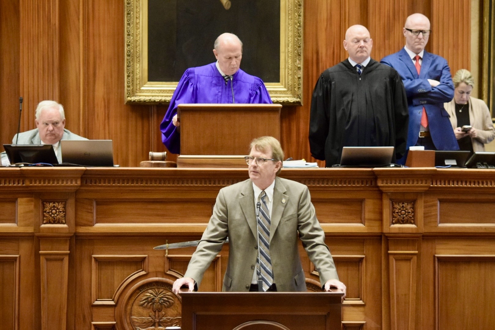 South Carolina State Senator Richard Cash speaking on the Senate floor during a redistricting debate, news photography style