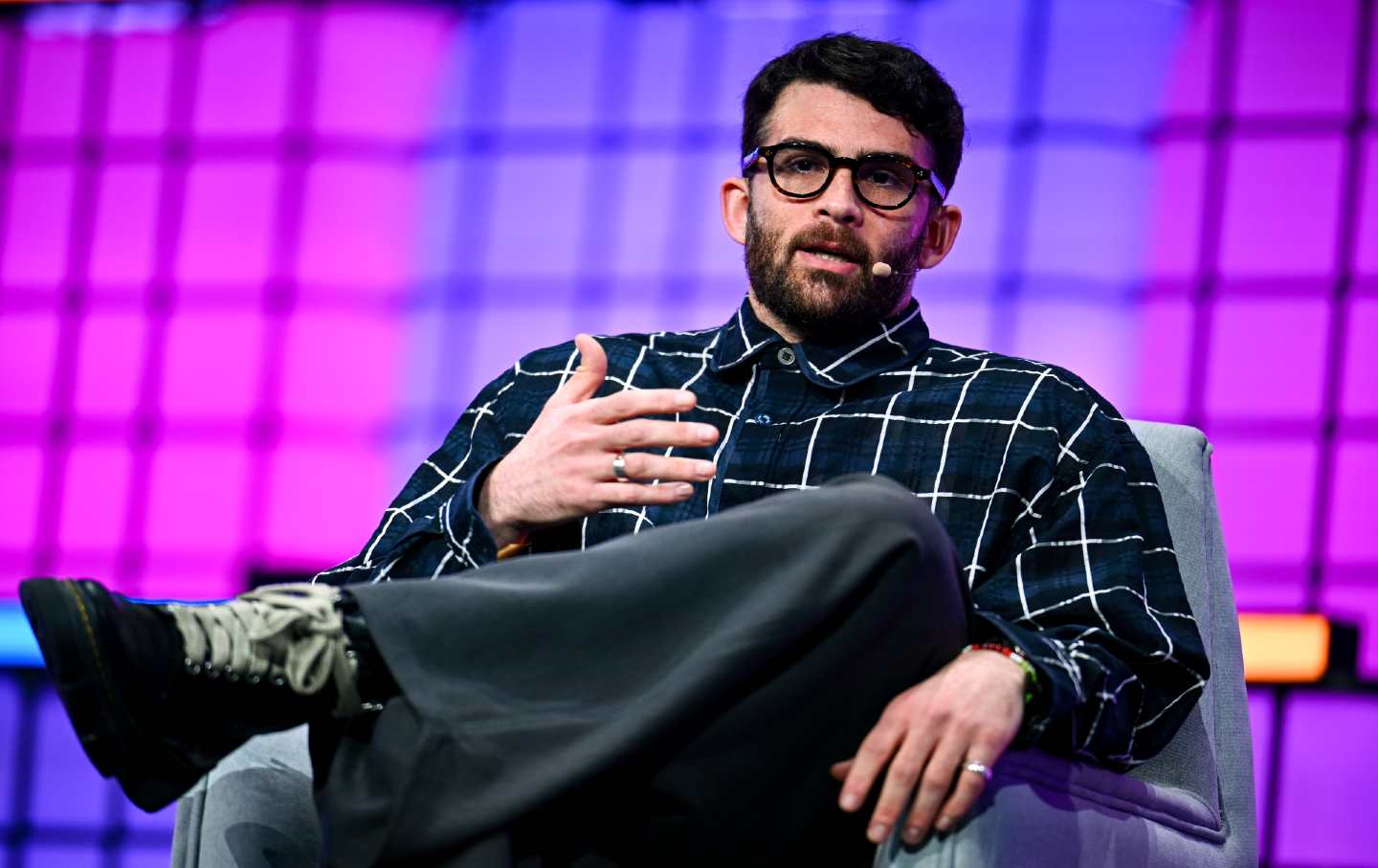 Streamer Hasan Piker pictured at a public event or on a stage, photographed in a candid moment