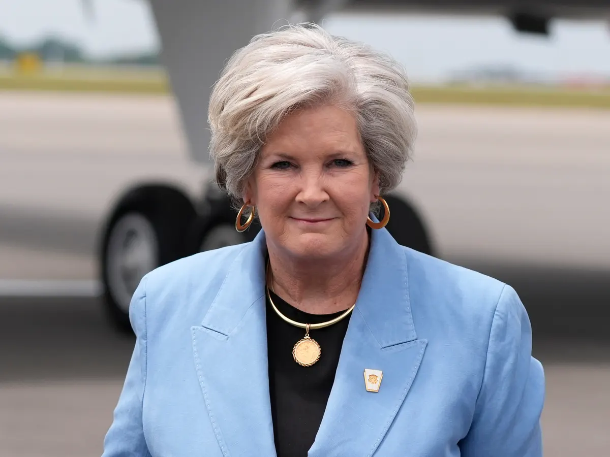 Susie Wiles at a public political event, photographed in a candid news-style setting