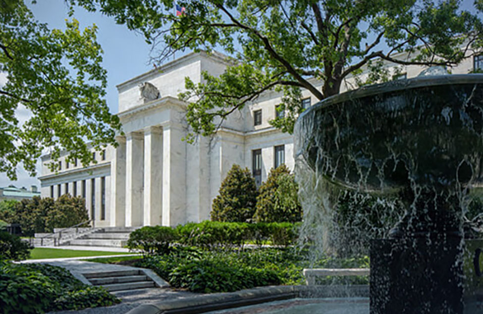 The Federal Reserve Board building in Washington, D.C., viewed from the street in daylight