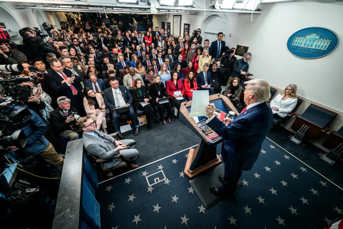 The James S. Brady Press Briefing Room at the White House, photographed from the press seating area facing the lectern
