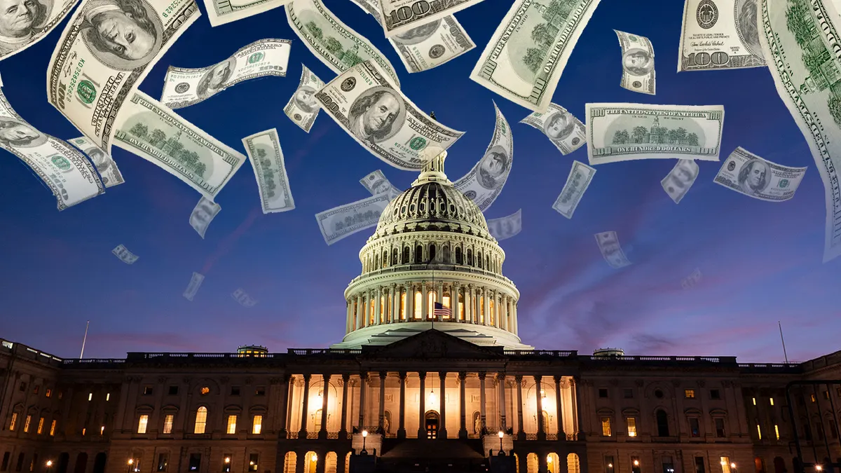 The U.S. Capitol at dusk with security barriers and a small group of reporters gathered outside, news photography style