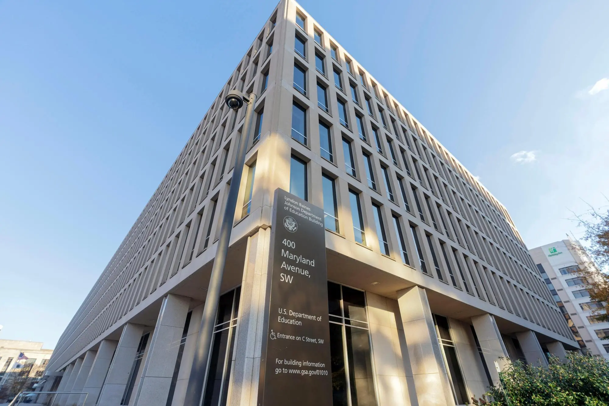The U.S. Department of Education headquarters building in Washington, D.C., photographed from the street with the agency name visible on the facade