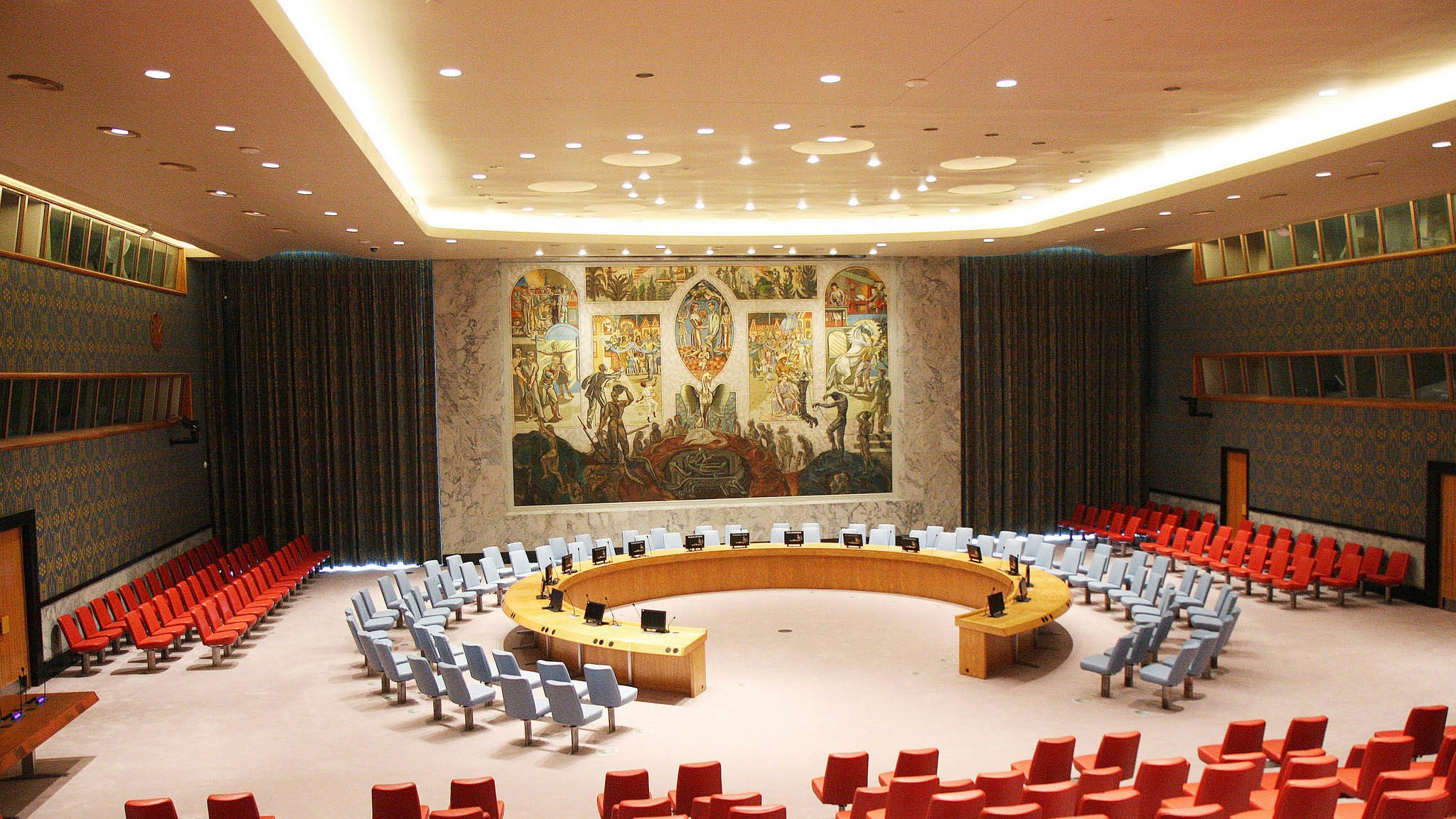 The United Nations Security Council chamber with delegates seated around the circular table