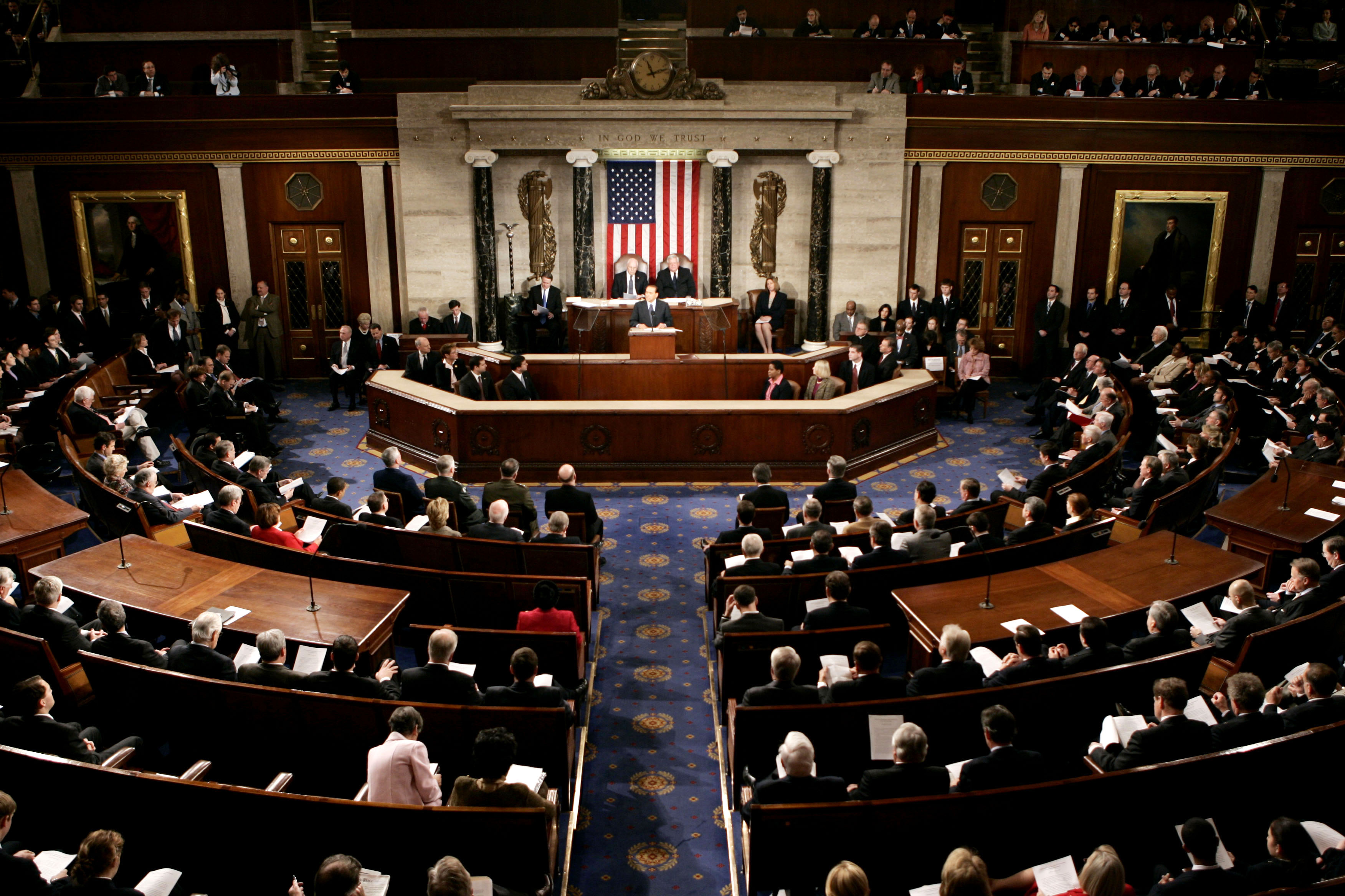 The United States Senate chamber in Washington, DC, photographed from the visitors gallery with senators' desks visible