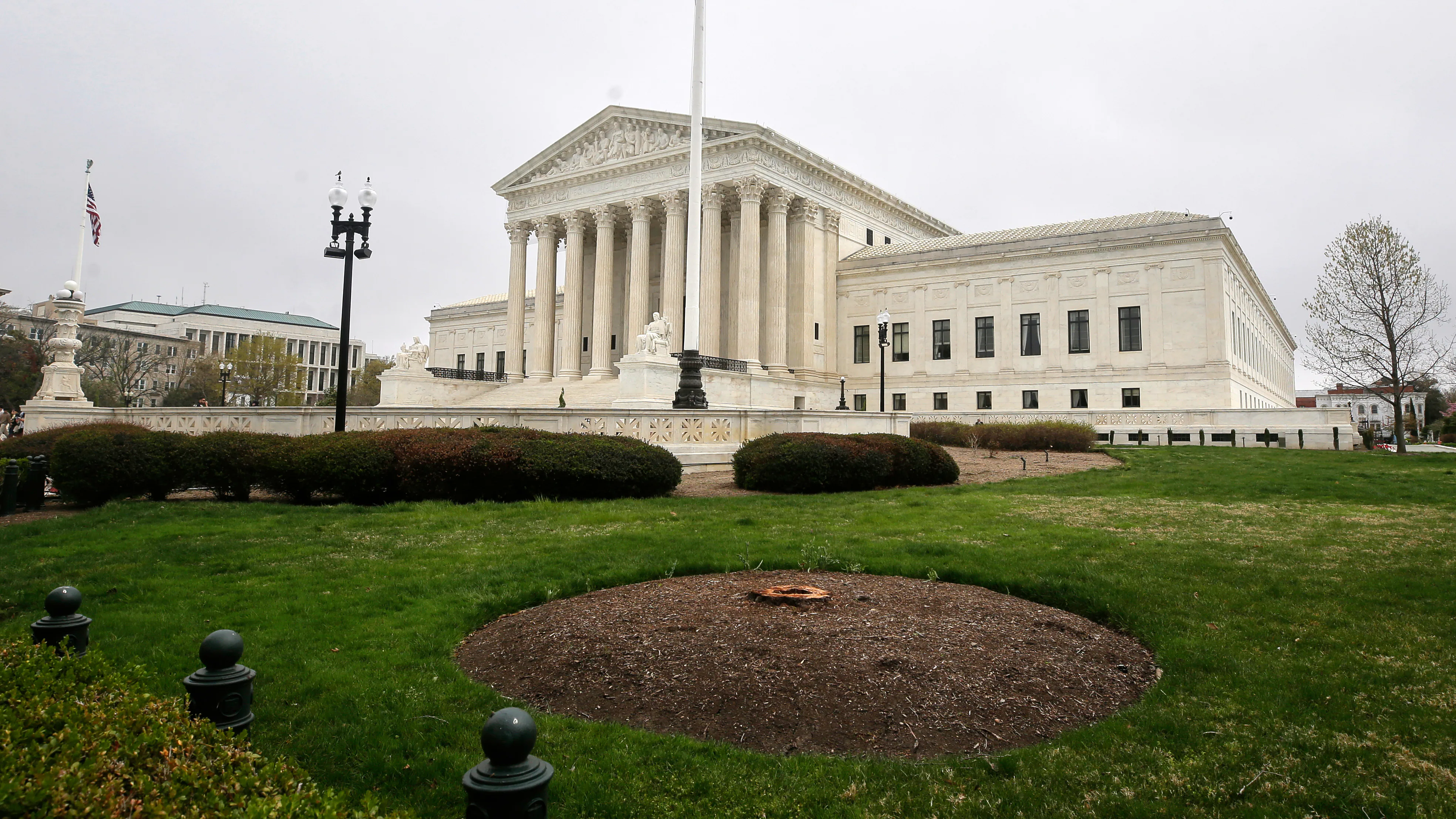 The United States Supreme Court building in Washington, D.C., photographed from the front steps on a clear day, news photography style