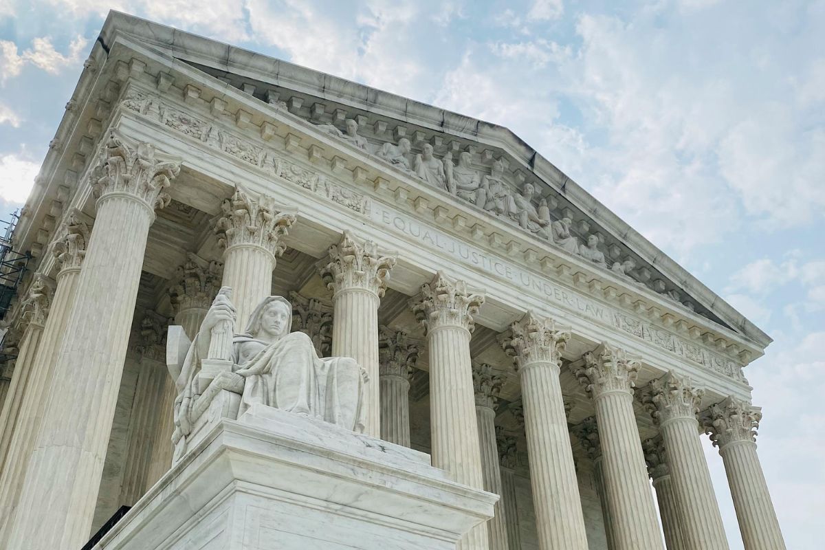The United States Supreme Court building in Washington, D.C., photographed from the front with the marble facade and steps visible