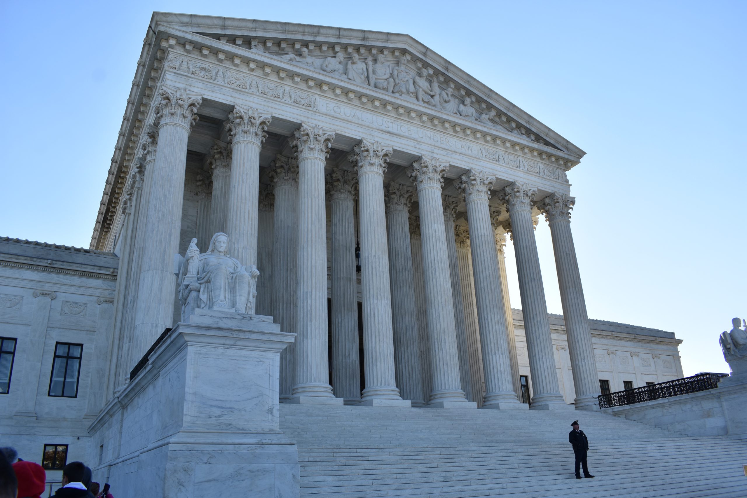 The United States Supreme Court building in Washington, D.C., photographed from the front steps with the marble columns visible