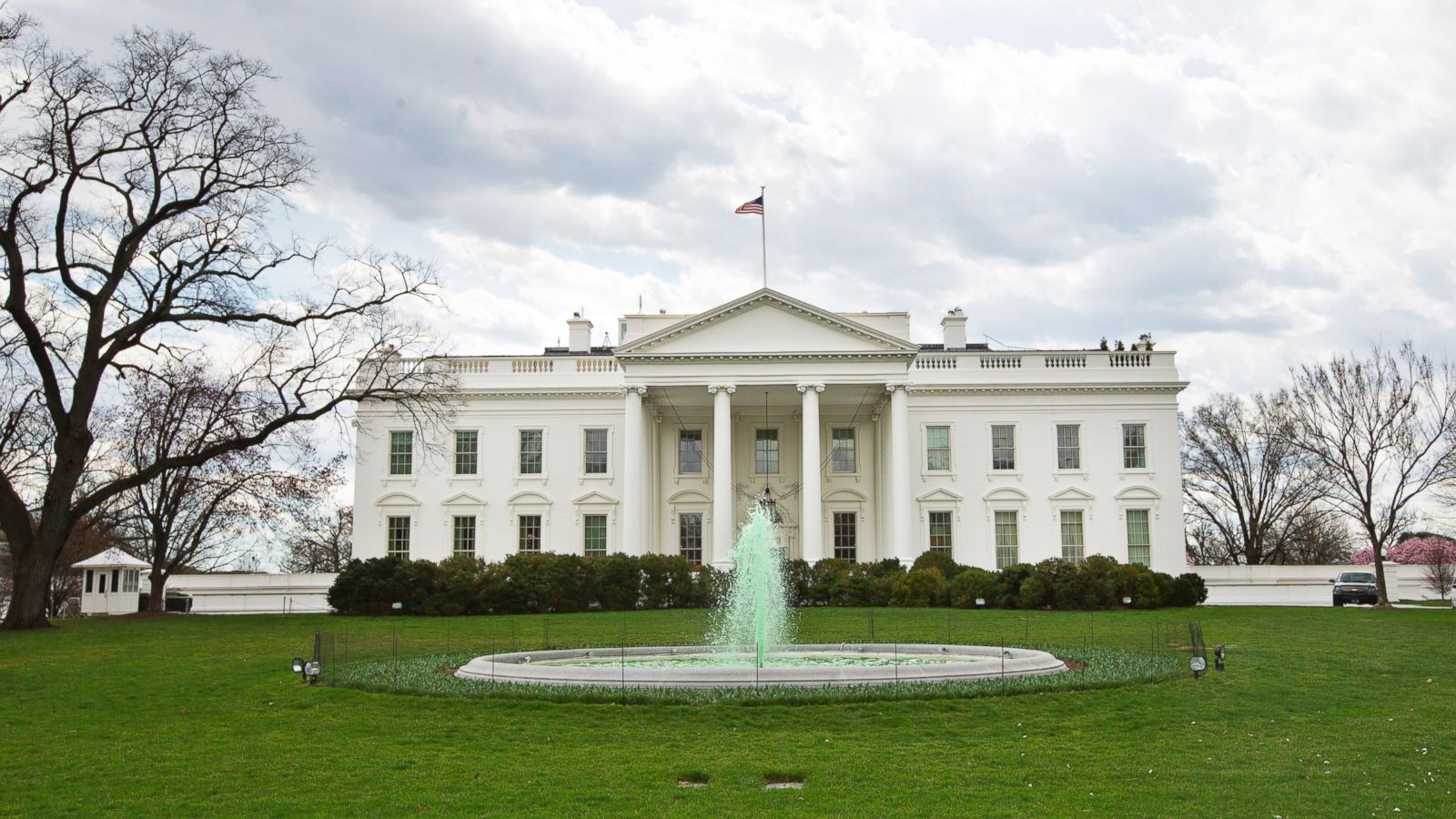 The White House viewed from the North Lawn in Washington, D.C., with the fountain in the foreground on a clear day