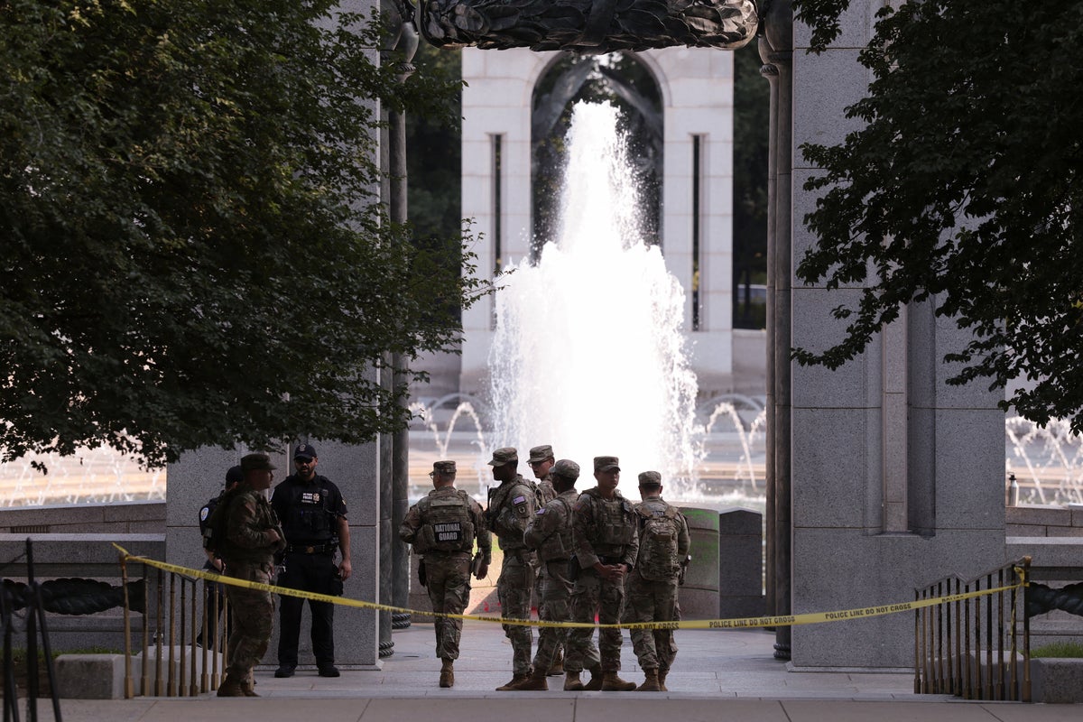 The World War II Memorial on the National Mall in Washington, D.C., showing the stone pillars and central fountain in a clear daytime photograph