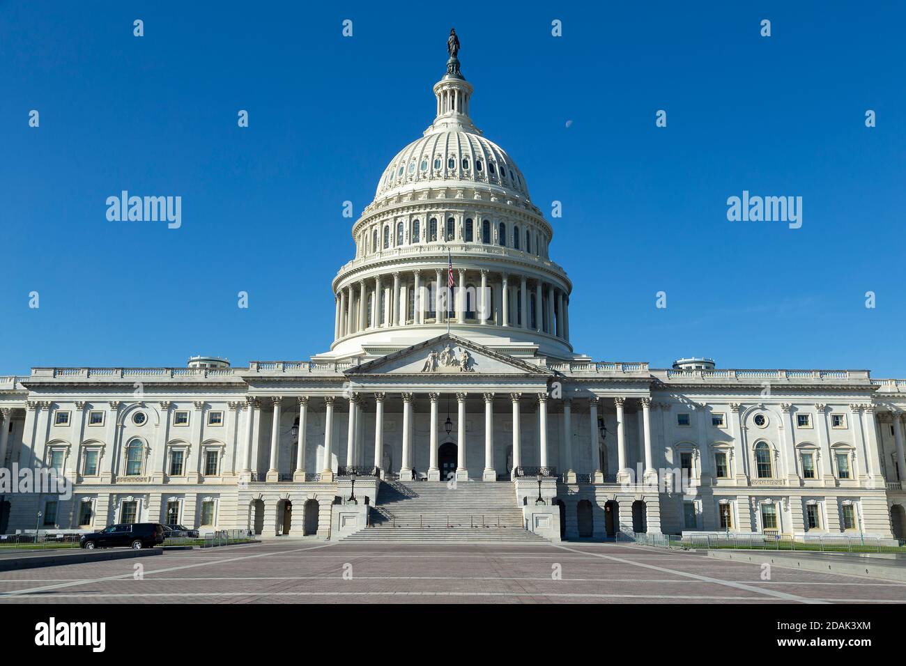 The east front of the United States Capitol in Washington, D.C., photographed in daylight with visitors walking on the grounds, news photography style