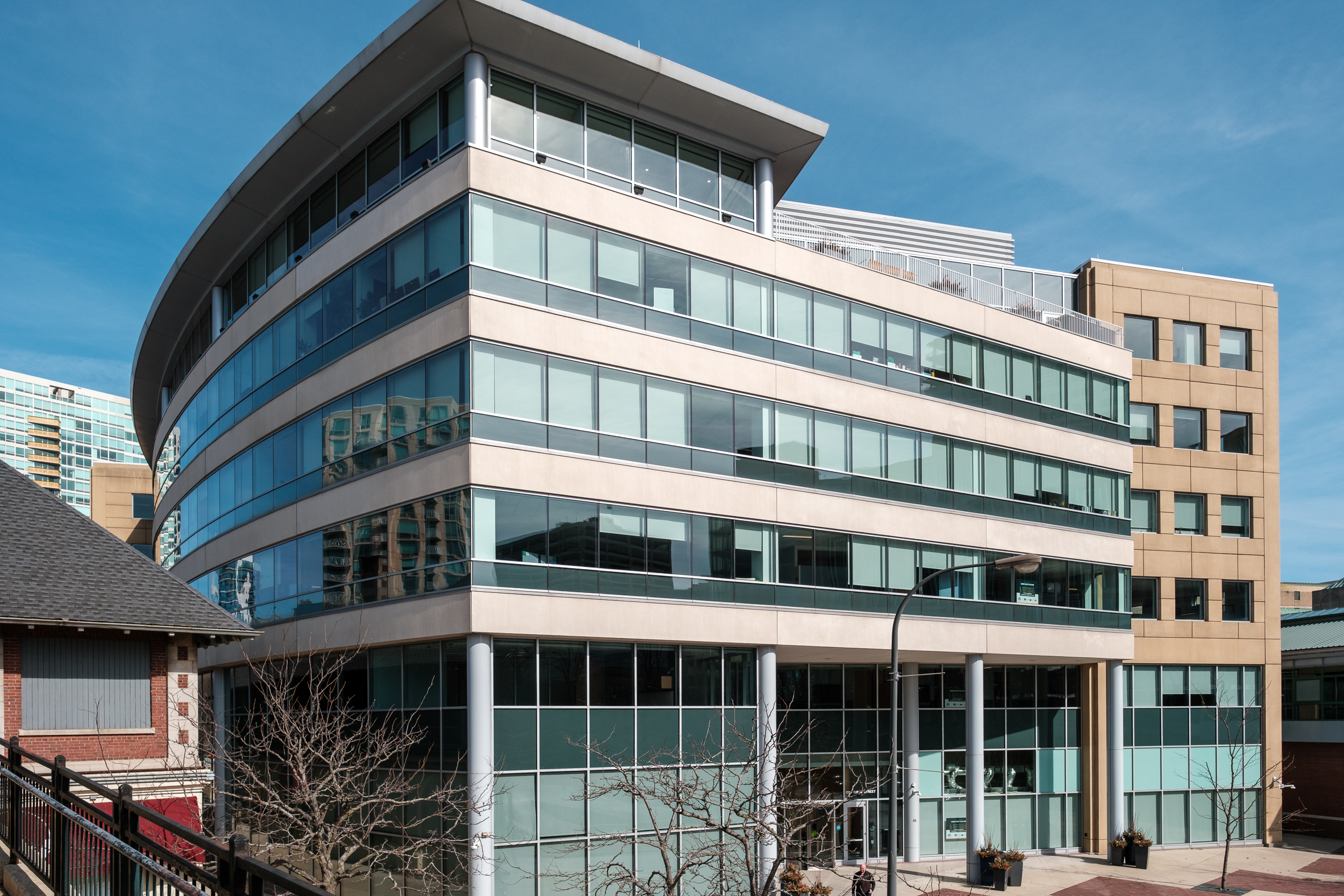 The exterior of Evanston City Hall in Evanston, Illinois on a clear day, with the building entrance visible, news photography style