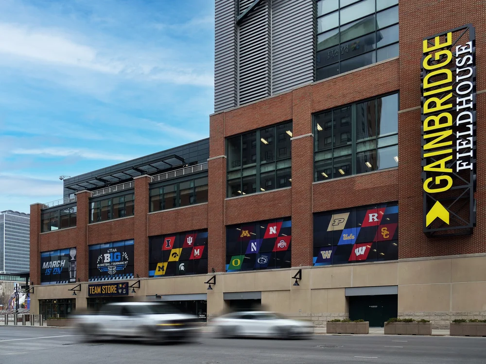 The exterior of Gainbridge Fieldhouse in downtown Indianapolis, with arena signage visible.