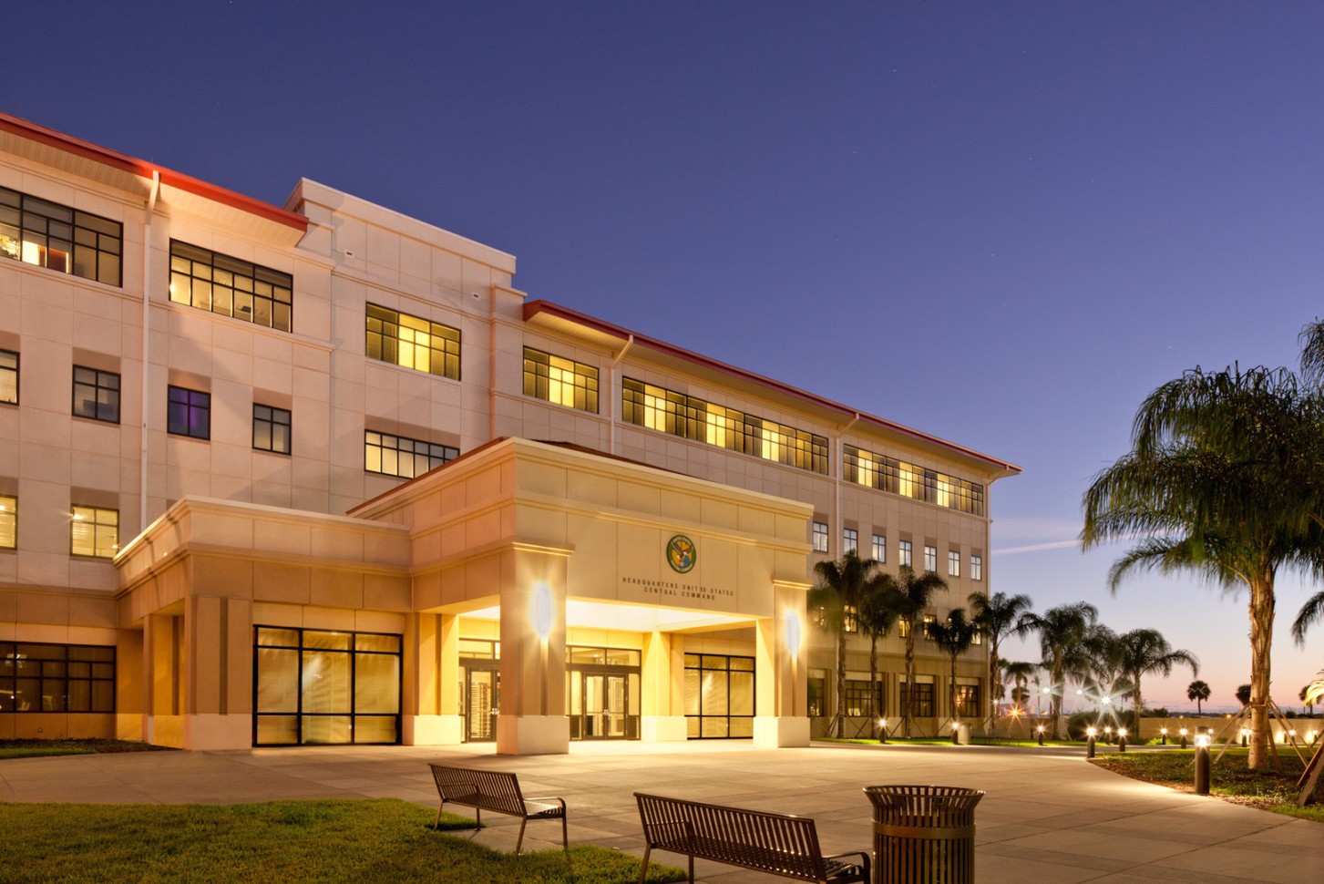 The exterior of a U.S. military headquarters building with signage and a flagpole, photographed in daylight in a standard news photo style