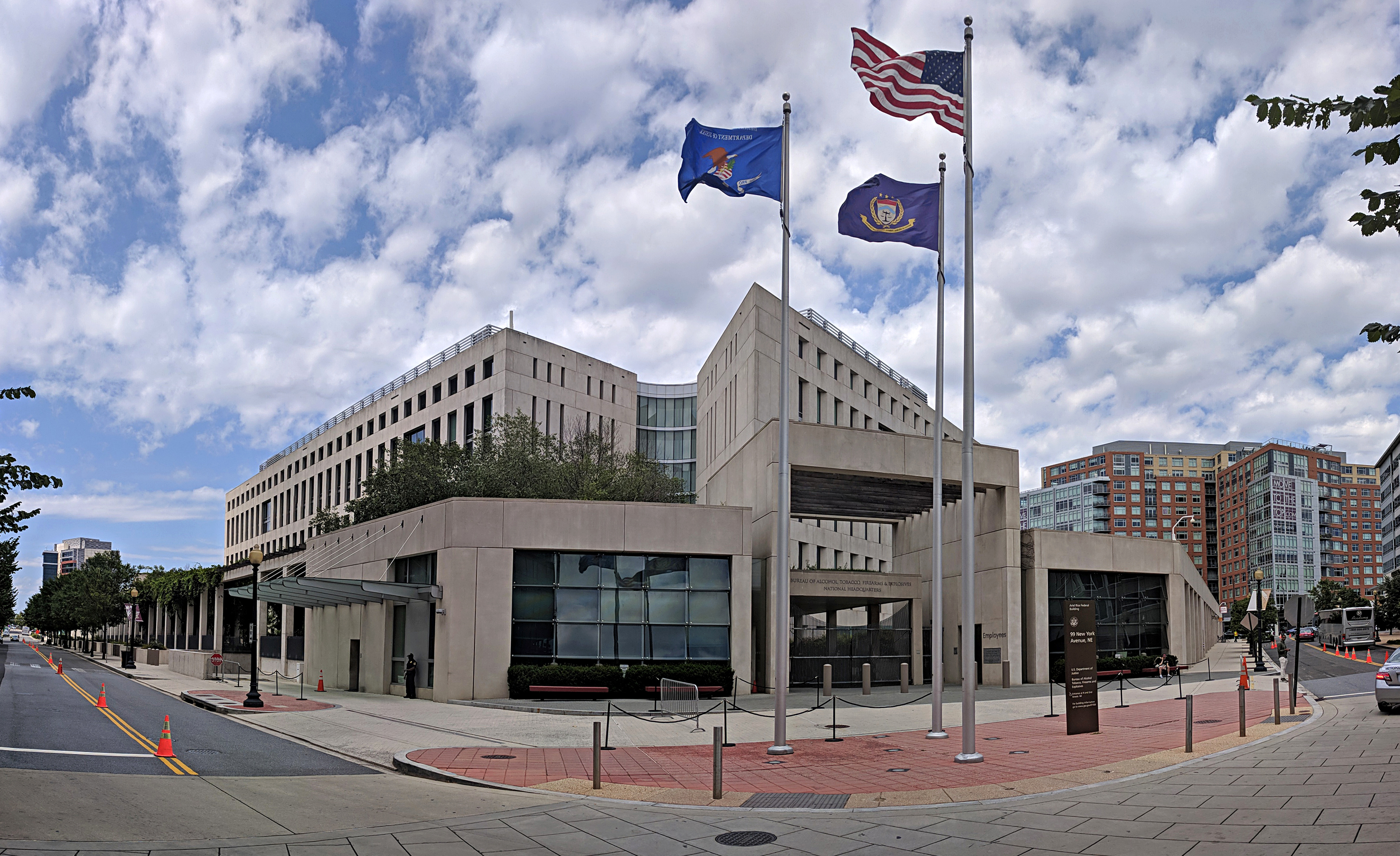 The exterior of the Bureau of Alcohol, Tobacco, Firearms and Explosives building in Washington, D.C., photographed in daylight, news photography style