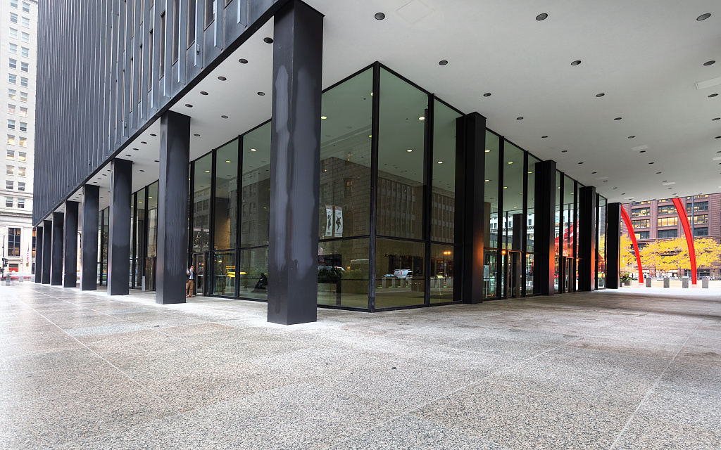 The exterior of the Dirksen United States Courthouse in Chicago, showing the building facade and the plaza area in daylight