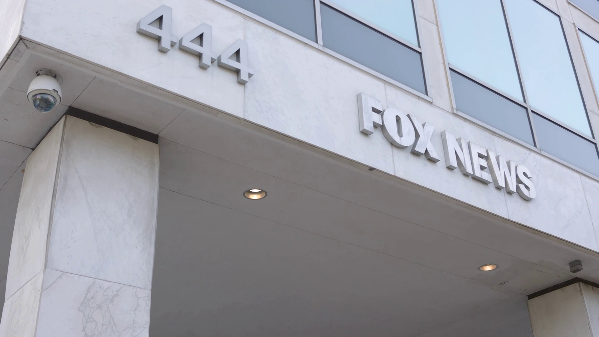 The exterior of the Fox News headquarters building in New York City, photographed from street level.