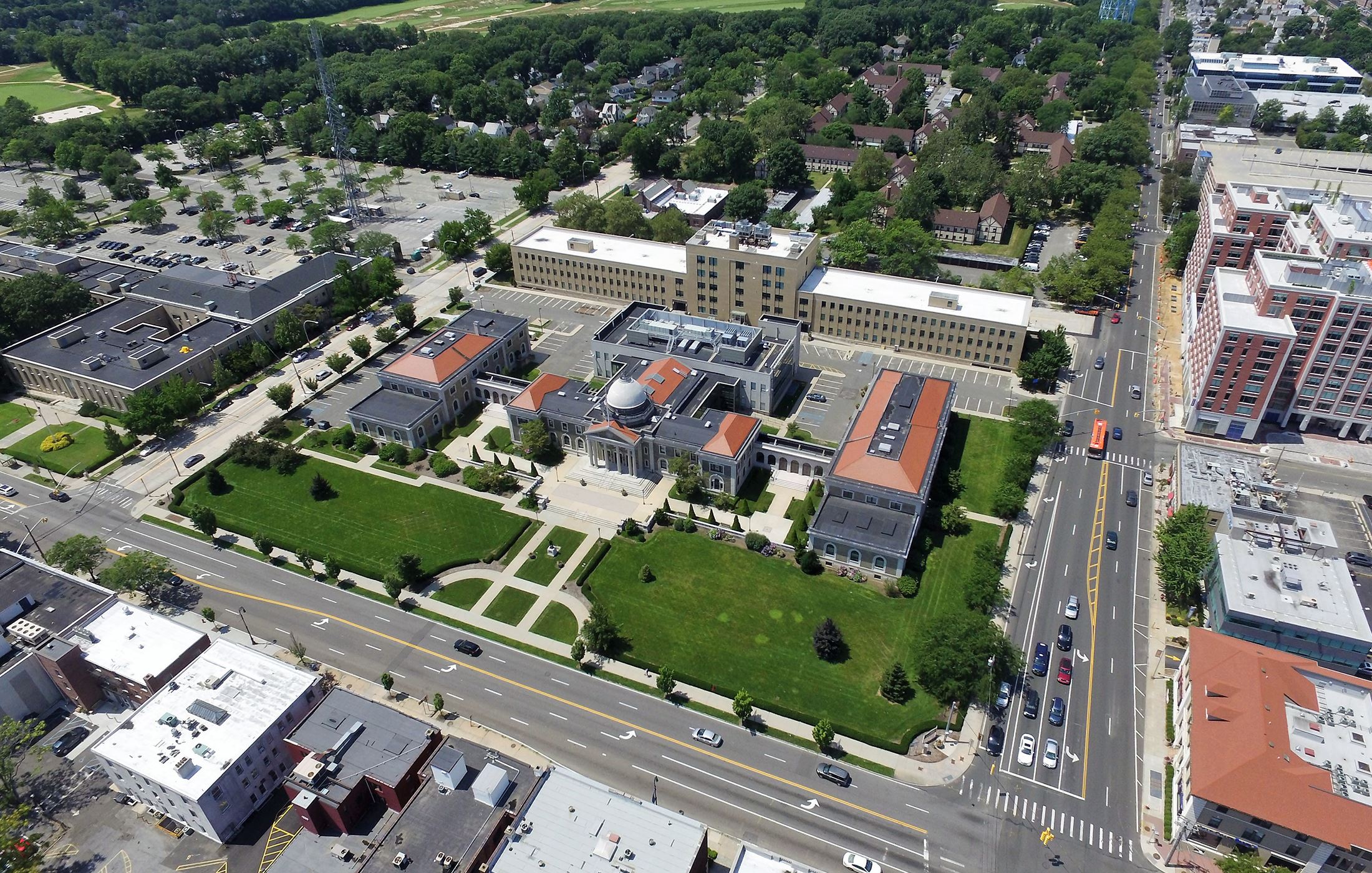 The exterior of the Nassau County Police Department building in Mineola, New York, photographed in daylight