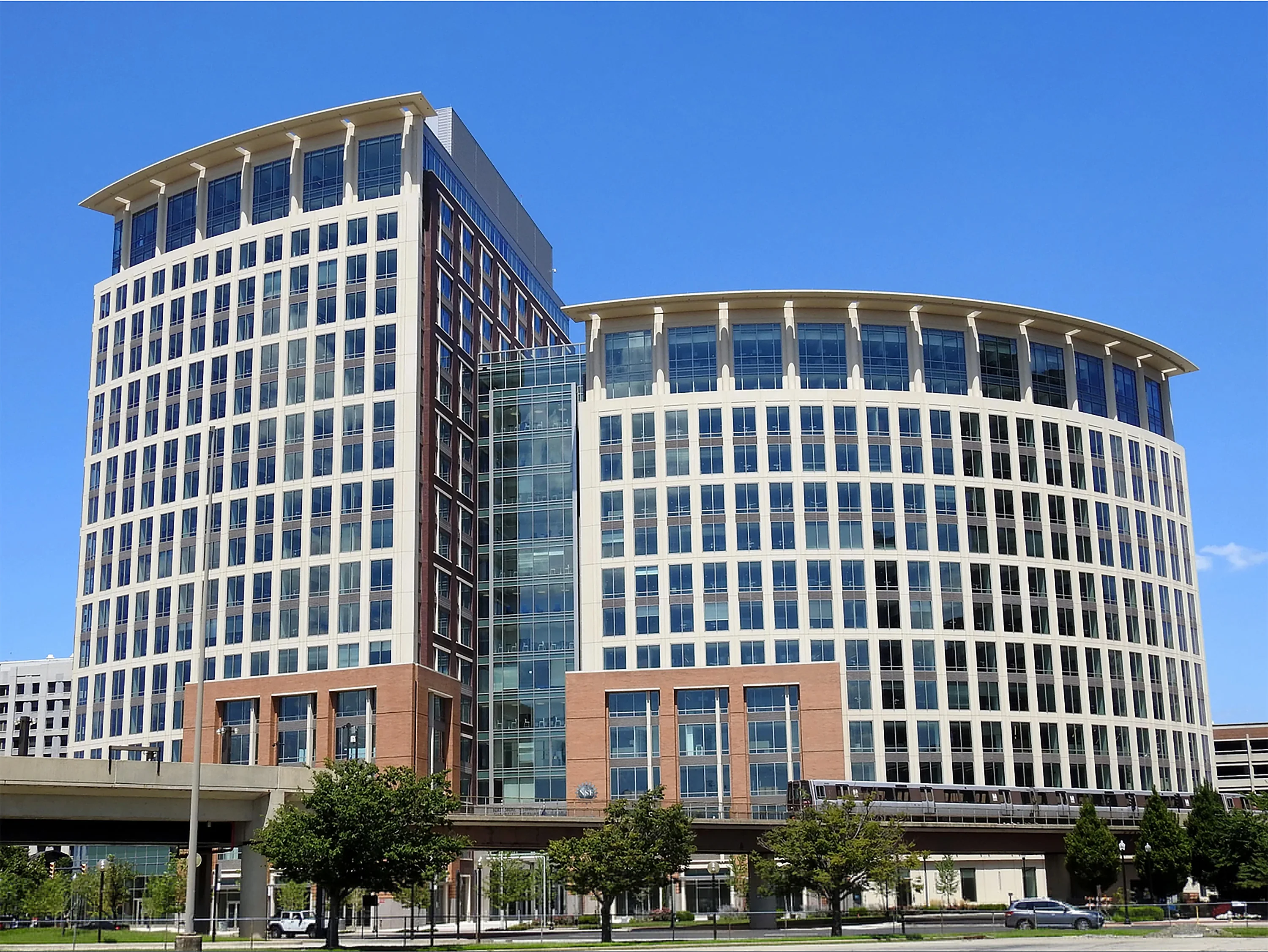 The exterior of the National Science Foundation headquarters building in Alexandria, Virginia, photographed in daylight with a clear view of the main entrance, news photography style