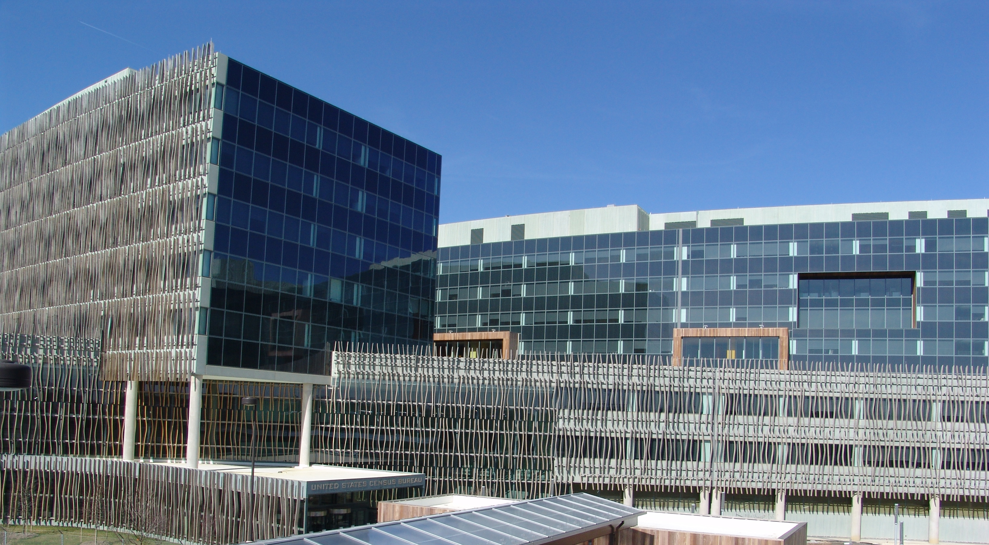 The exterior of the U.S. Census Bureau headquarters campus in Suitland, Maryland on a clear day, news photography style