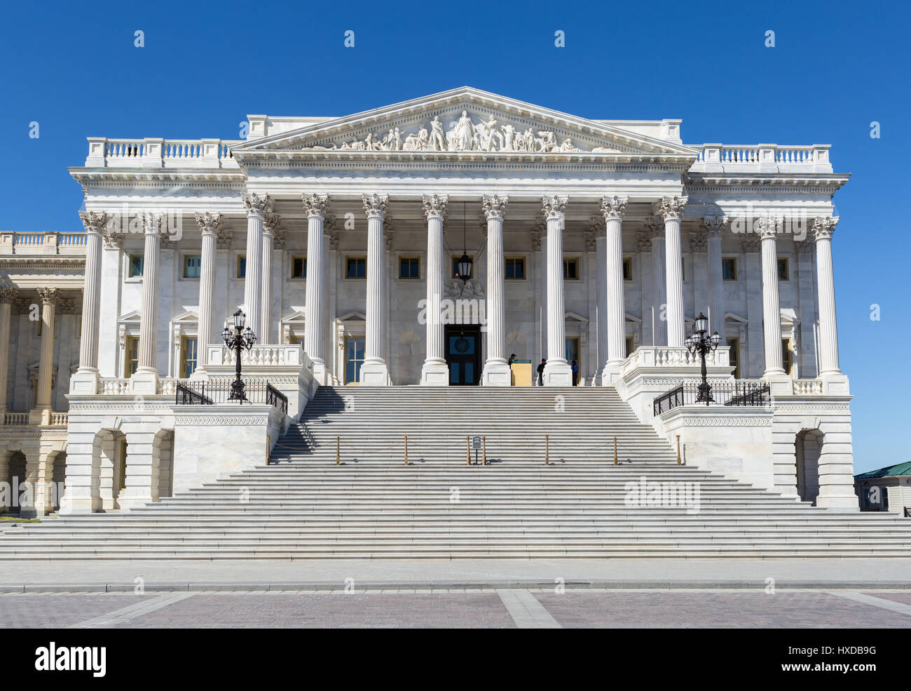 The exterior of the United States Capitol building focused on the Senate wing, photographed in daylight with clear architectural detail