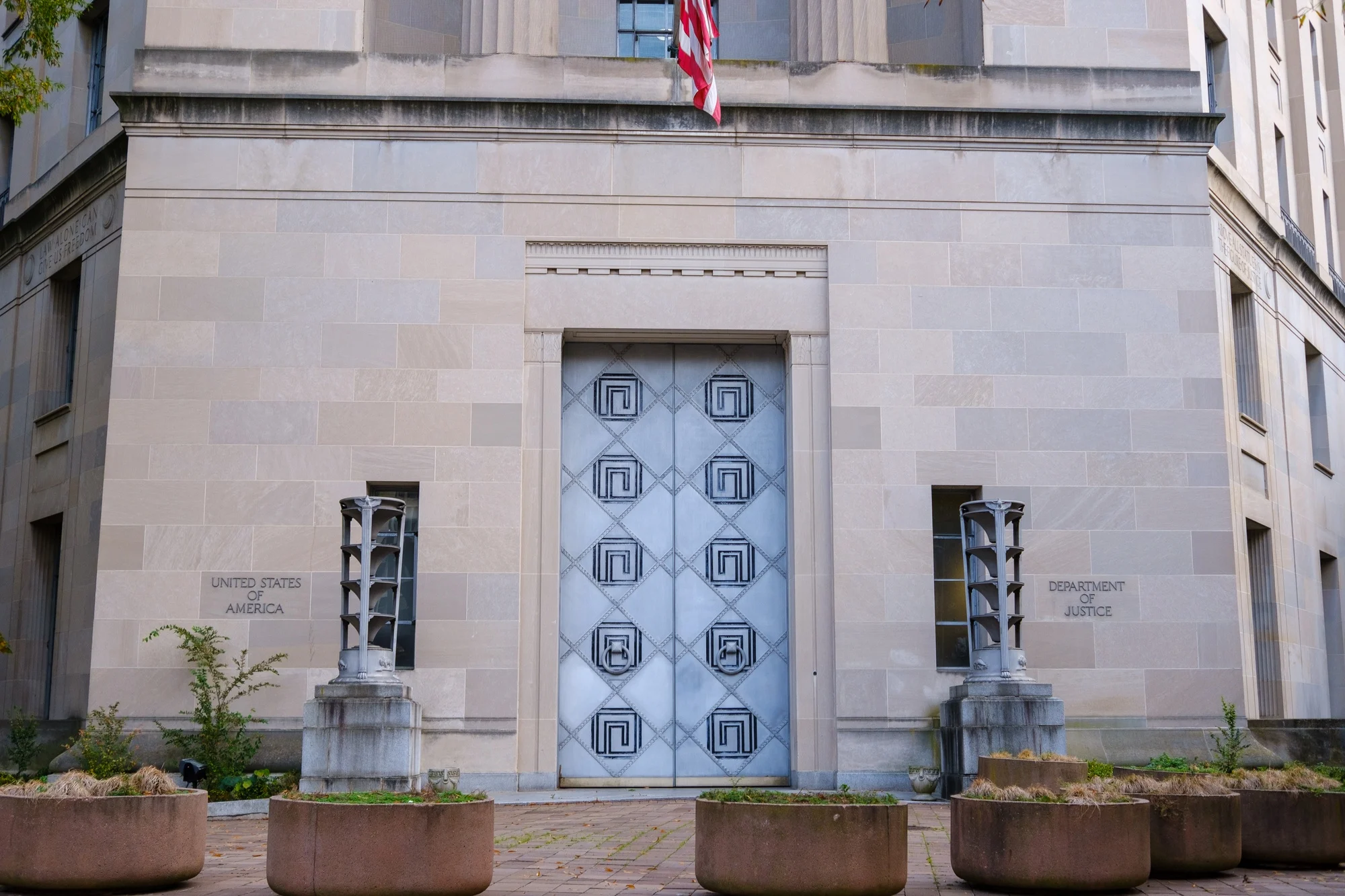 The exterior of the United States Department of Justice headquarters building in Washington, D.C., viewed from street level in daylight