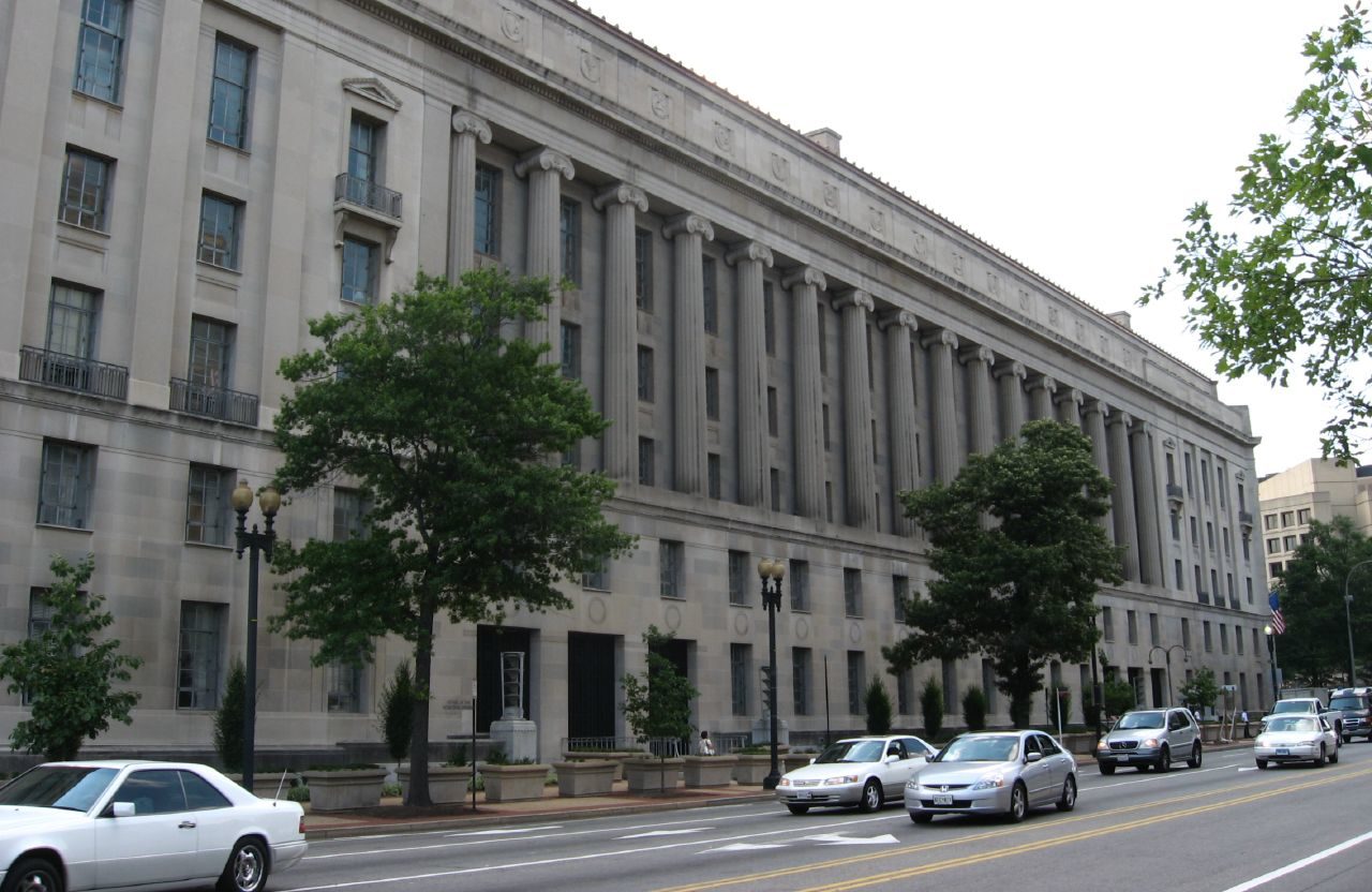 The exterior of the United States Department of Justice building in Washington, D.C., with the building signage visible