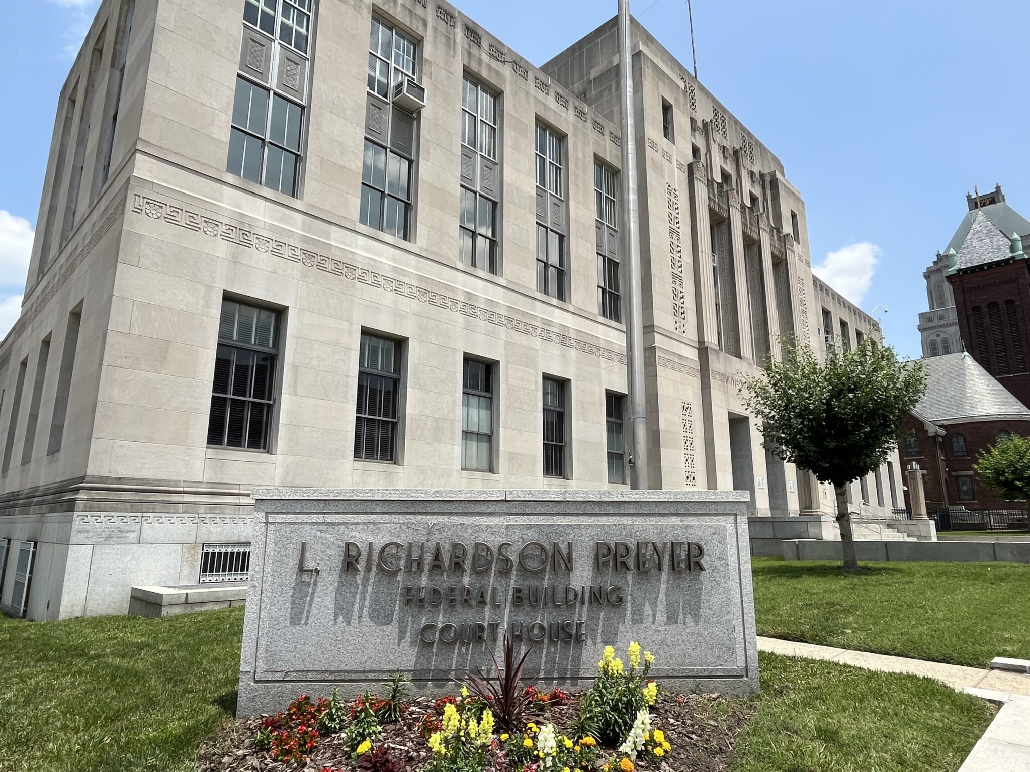 The exterior of the United States District Court for the Middle District of North Carolina, with courthouse signage visible