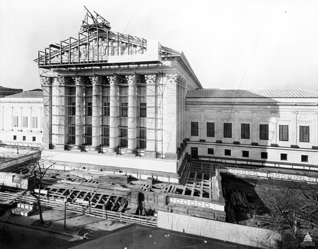 The exterior of the United States Supreme Court building in Washington, D.C. on a bright day, realistic news photography style