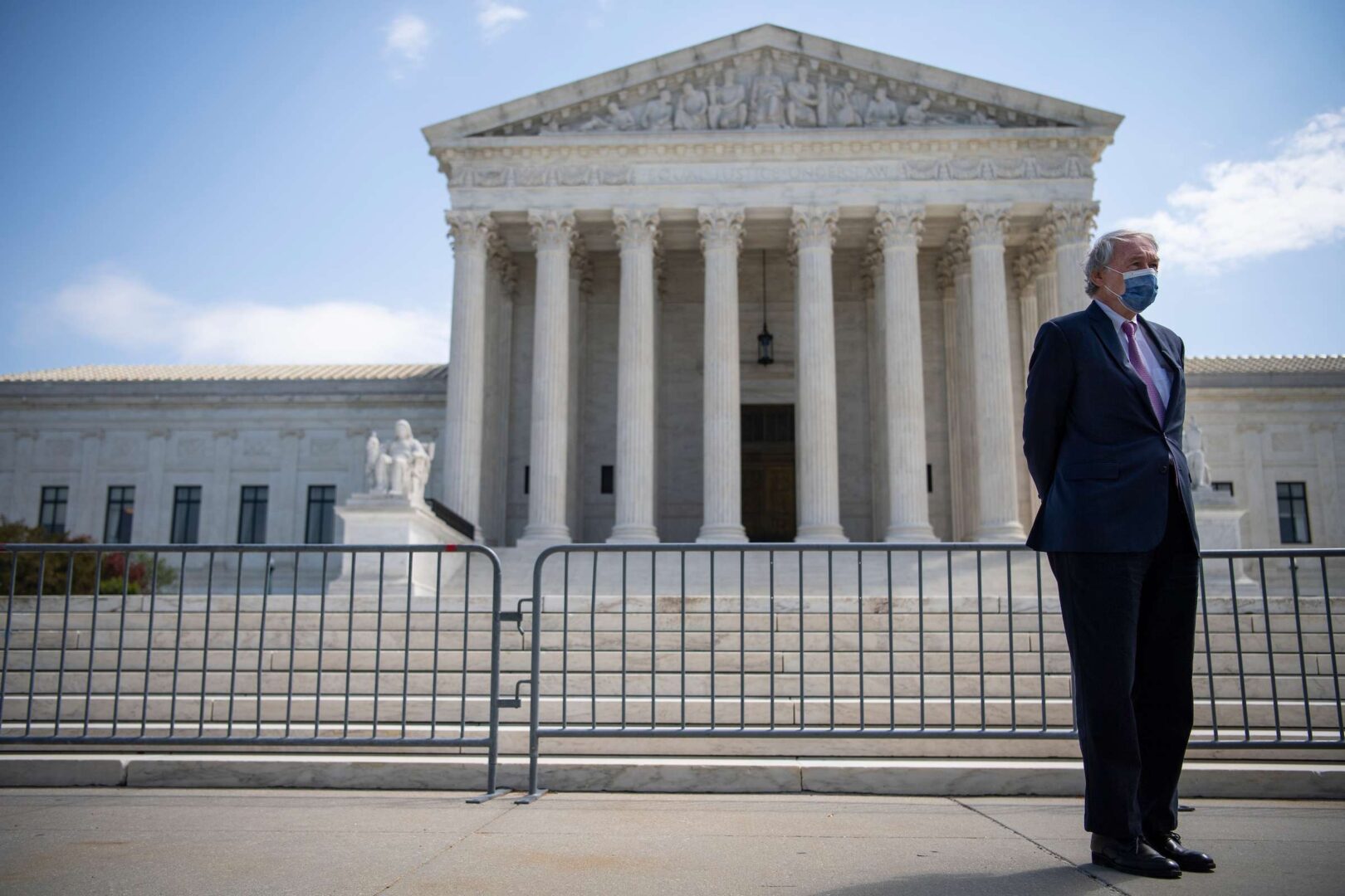 The exterior of the United States Supreme Court building in Washington, DC on a clear day, news photography style