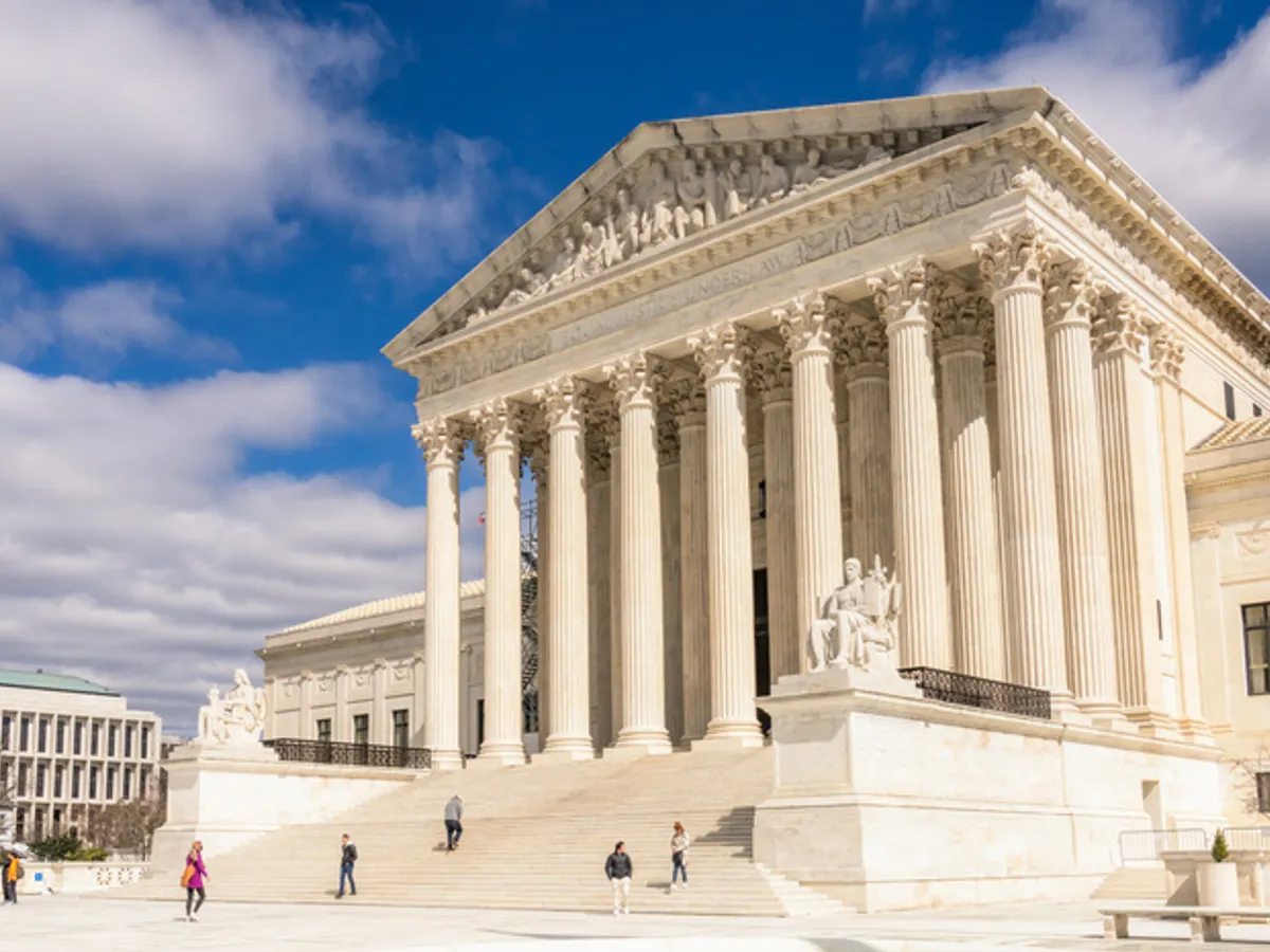 The exterior steps and columns of the Supreme Court of the United States in Washington, D.C., photographed in daylight, news-style editorial photo