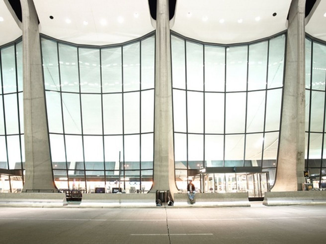 The main terminal building at Washington Dulles International Airport (IAD) in Virginia, with airport signage visible near the entrance.