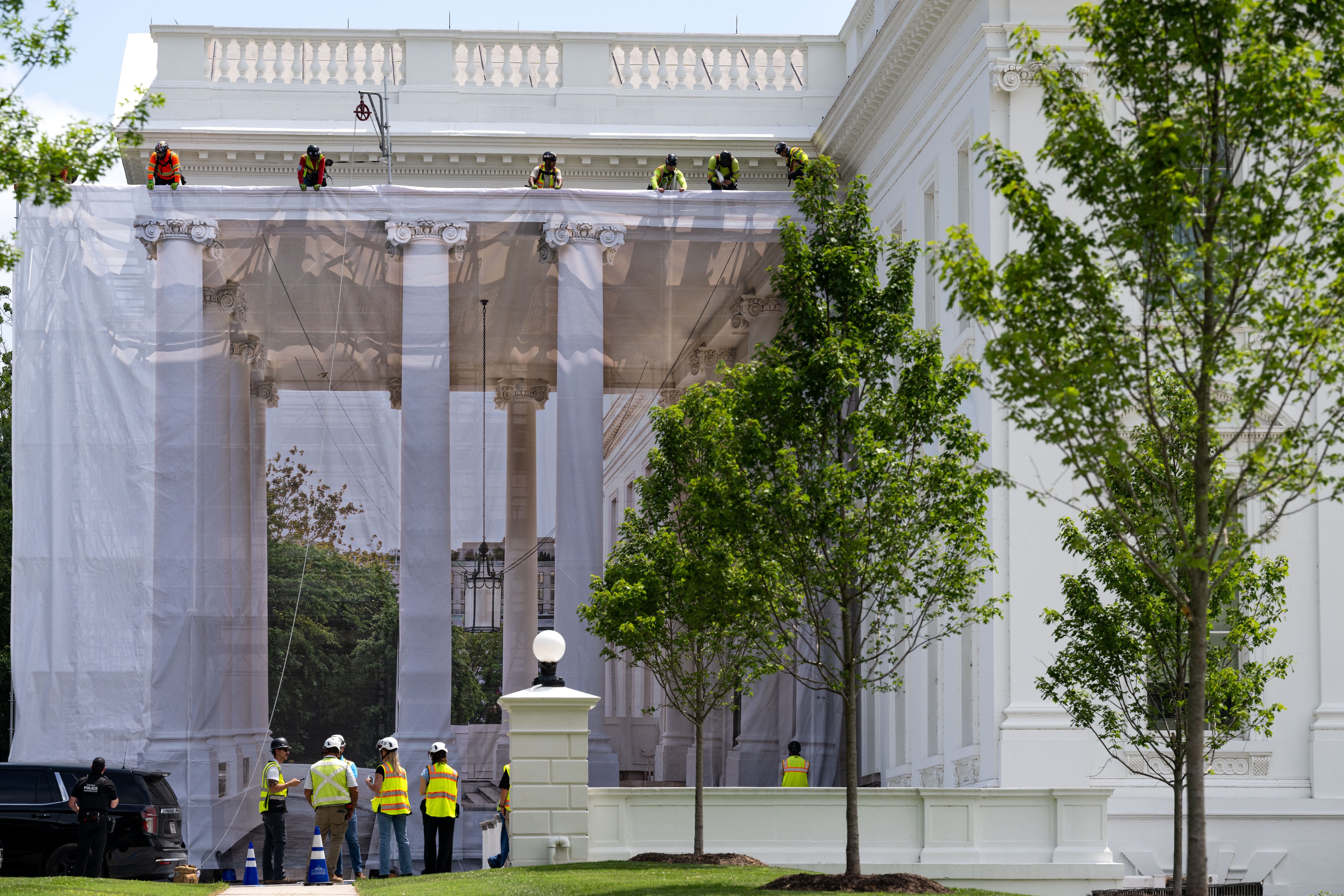 The north front of the White House with the North Portico visible in daylight, photographed from outside the White House fence