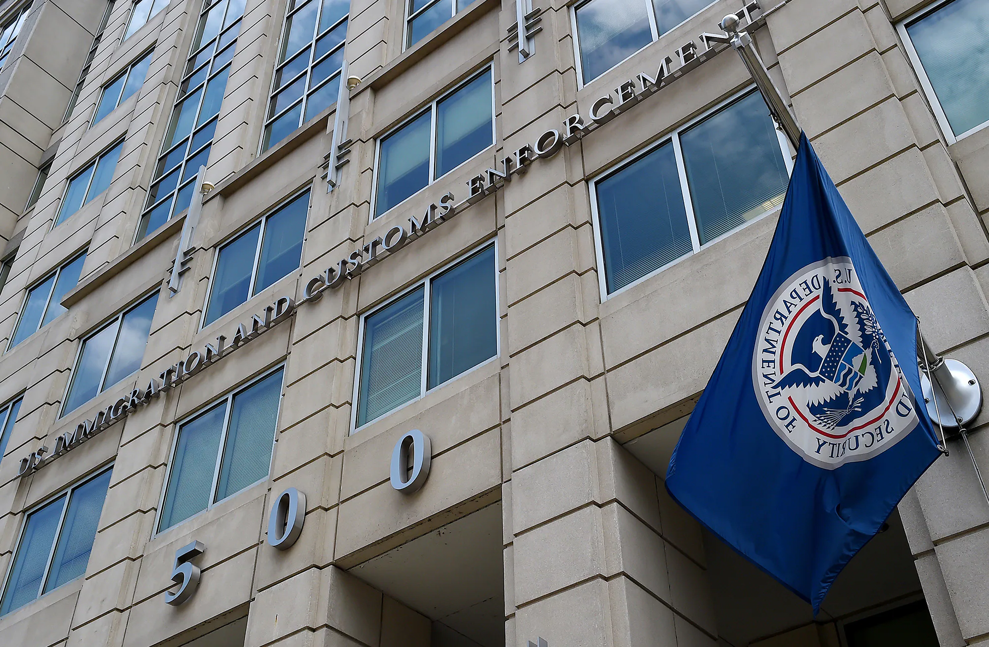 The seal of U.S. Immigration and Customs Enforcement displayed at a federal building in Washington, D.C.