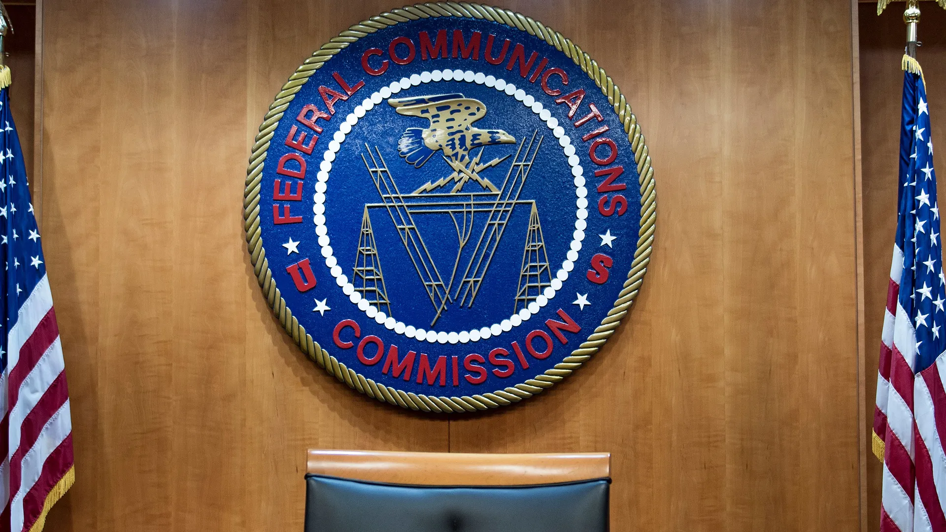 The seal of the Federal Communications Commission displayed at an FCC venue.